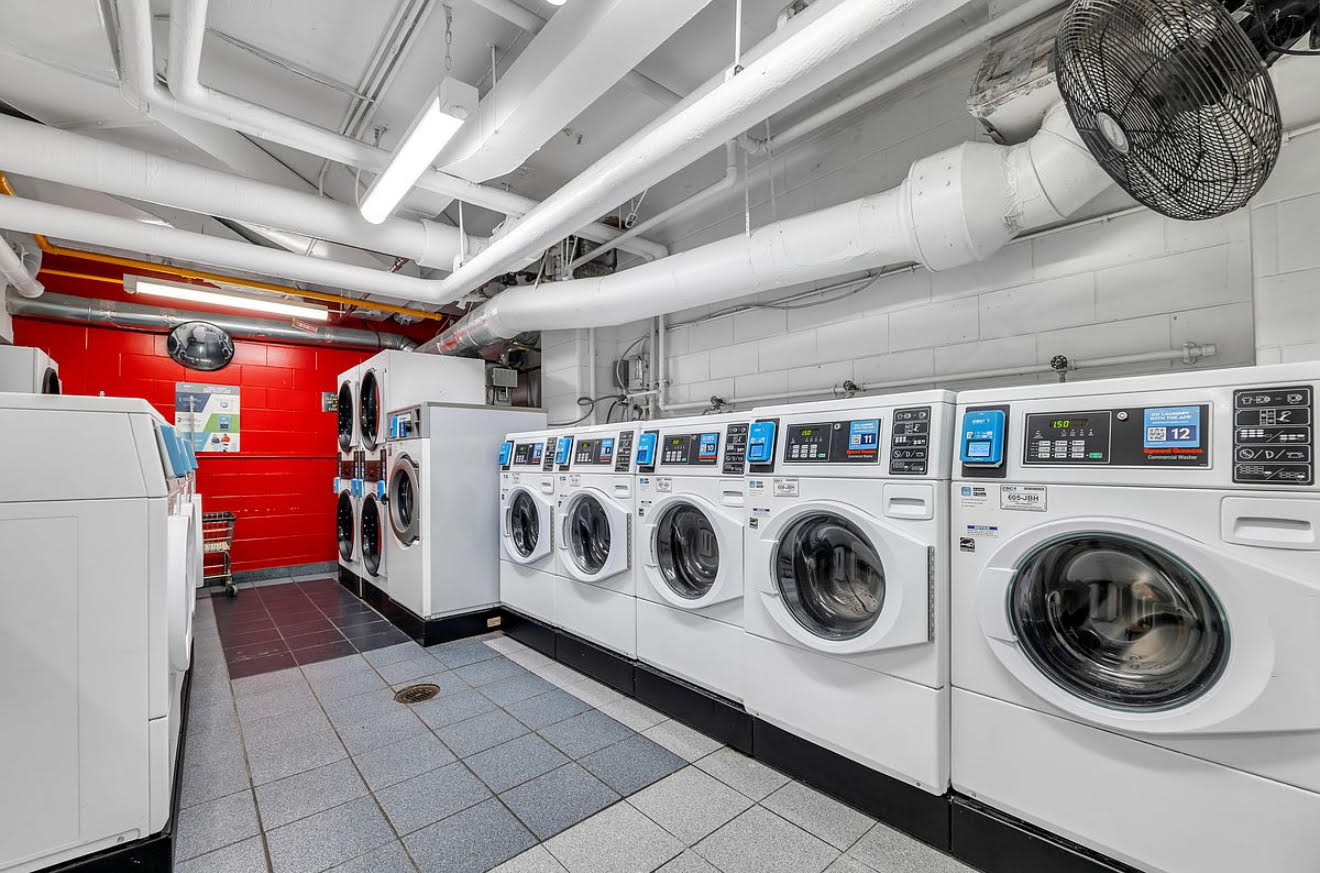 175 West 12th Street, Unit 5E Manhattan, NY 10011 - Photo 20 of 22 a utility room with dryer and washer