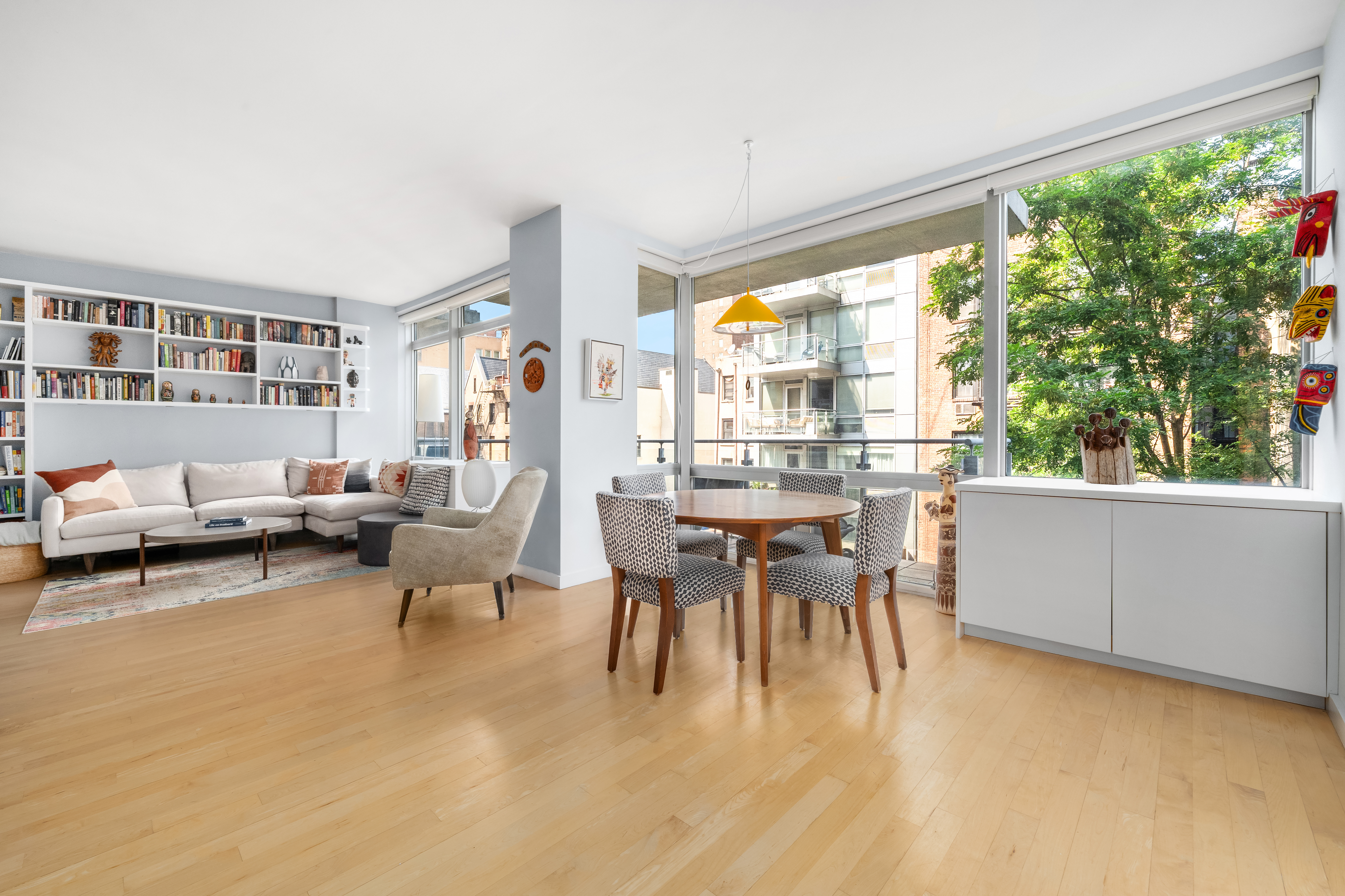 425 East 13th Street, Unit 4C Manhattan, NY 10009 - Photo 3 of 14 a dining room with furniture and a large window