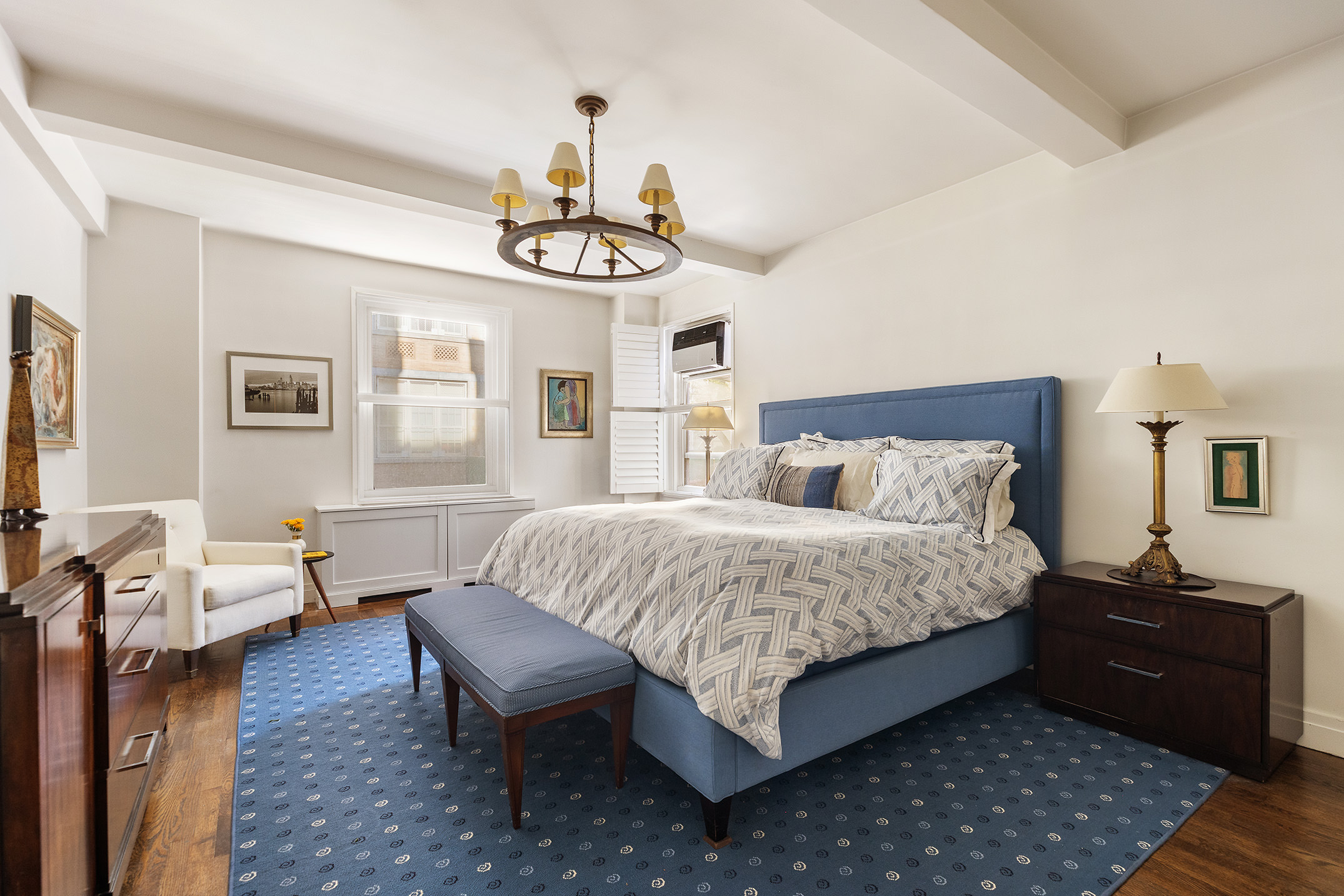 450 West End Avenue, Unit 3B Manhattan, NY 10024 - Photo 6 of 13 a bedroom with a bed and wooden floor