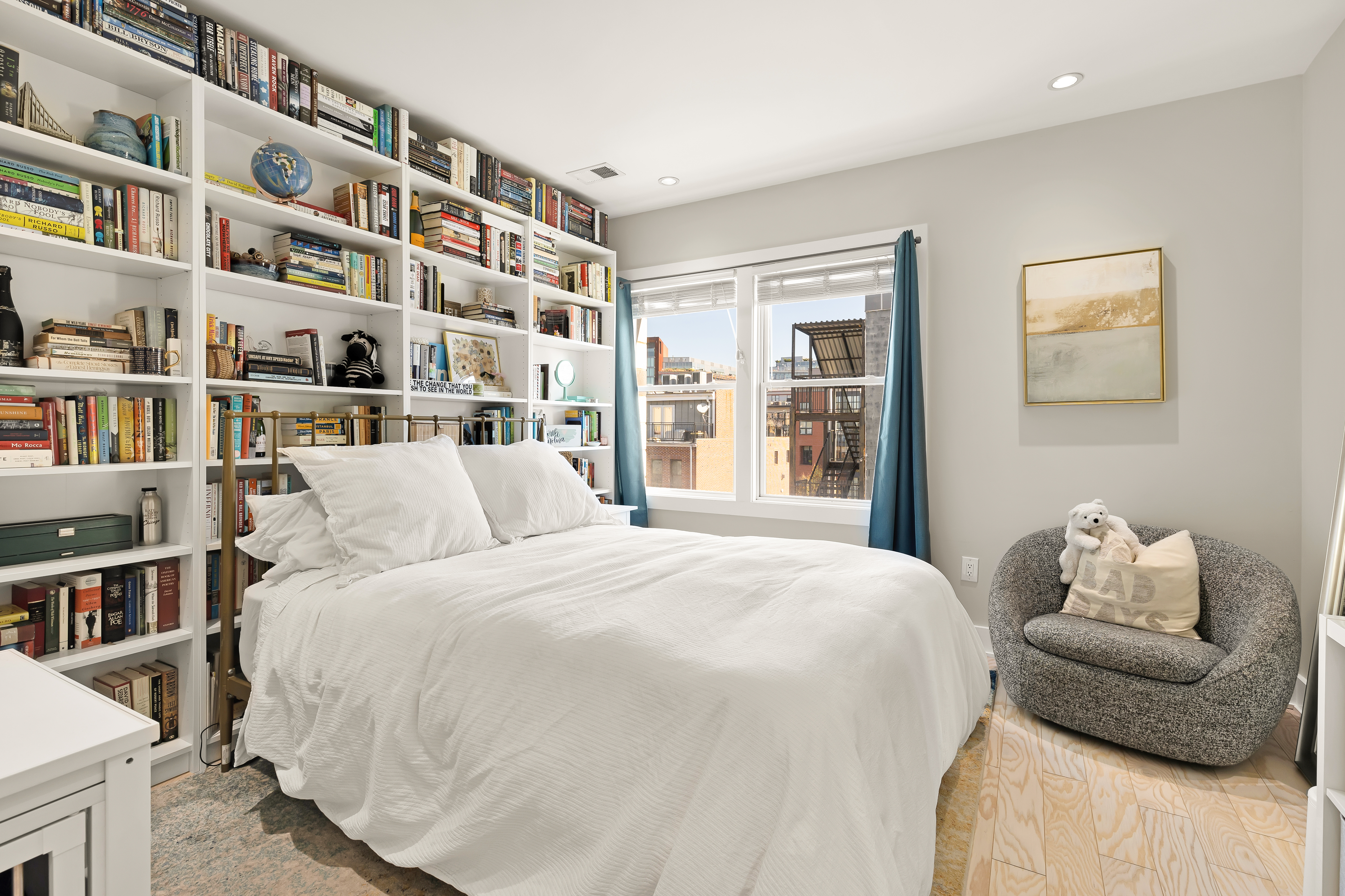 2101 11th Street Northwest, Unit 403 Washington, DC 20001 - Photo 19 of 30 a bedroom with a bed and a book shelf