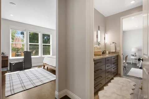 a bedroom with bed and a window