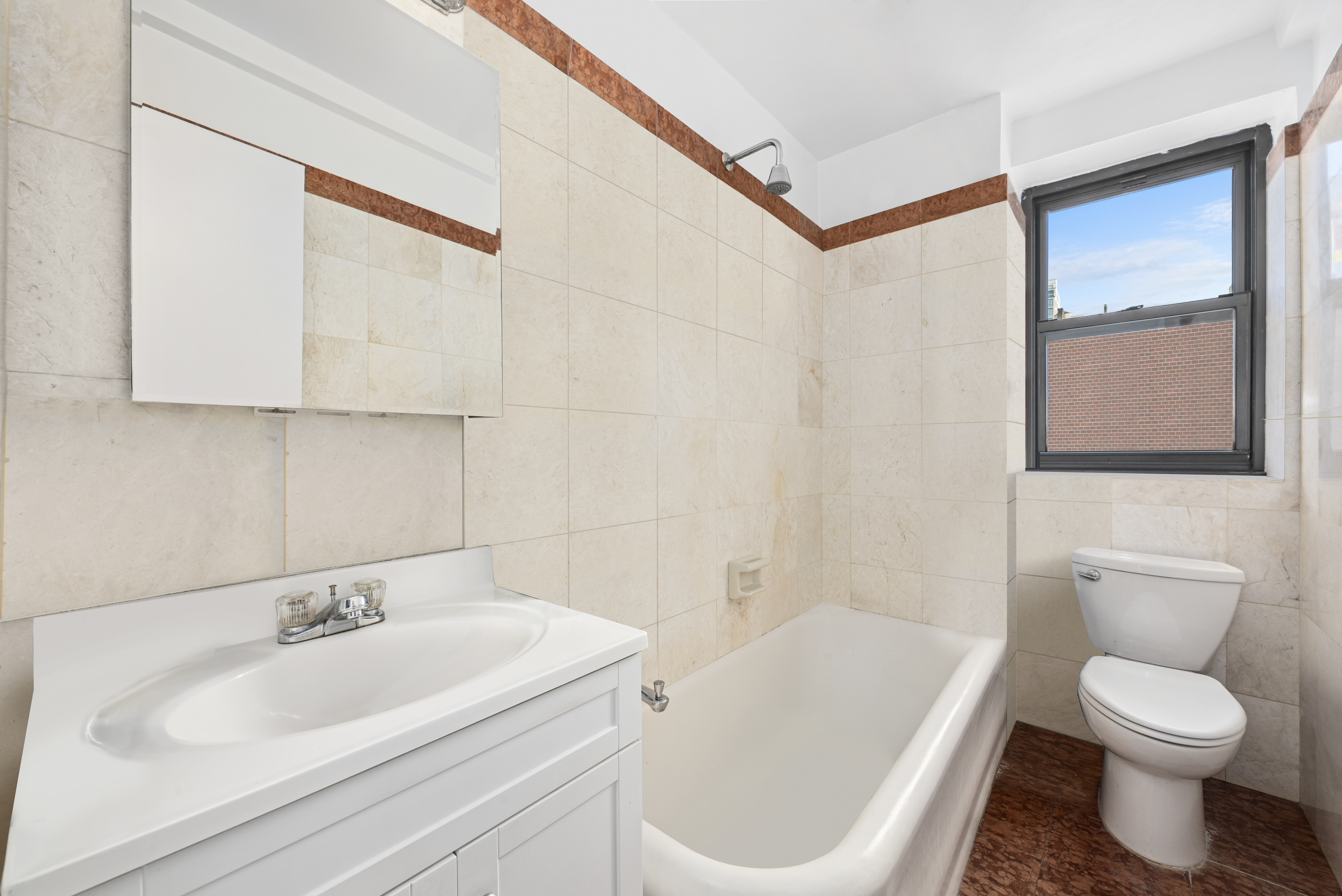 230 Riverside Drive, Unit 8L Manhattan, NY 10025 - Photo 6 of 11 a bathroom with a sink a toilet and bathtub