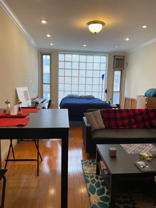 a room with furniture pool table and windows