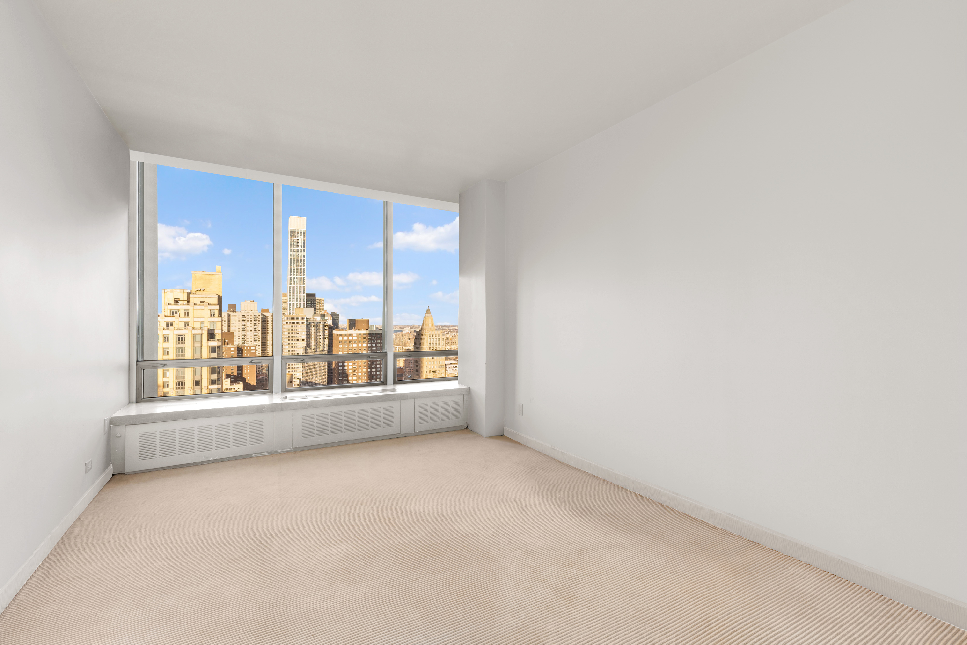 860 United Nations Plaza, Unit 36D Manhattan, NY 10017 - Photo 11 of 21 an empty room with a window