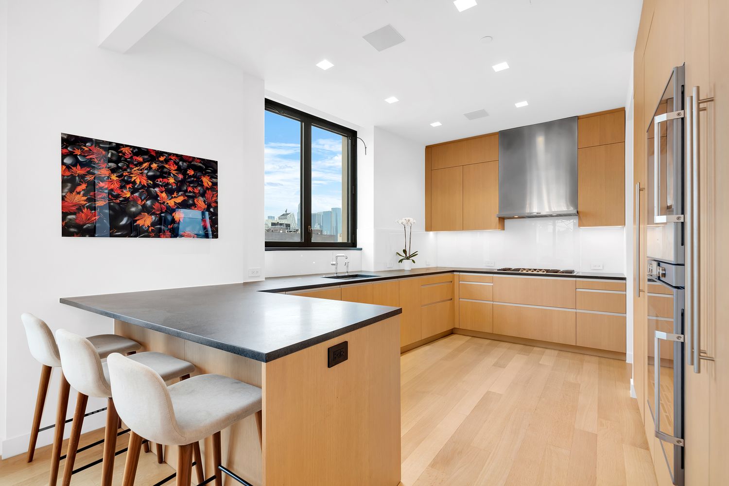 a kitchen with stainless steel appliances granite countertop a granite counter tops and a refrigerator