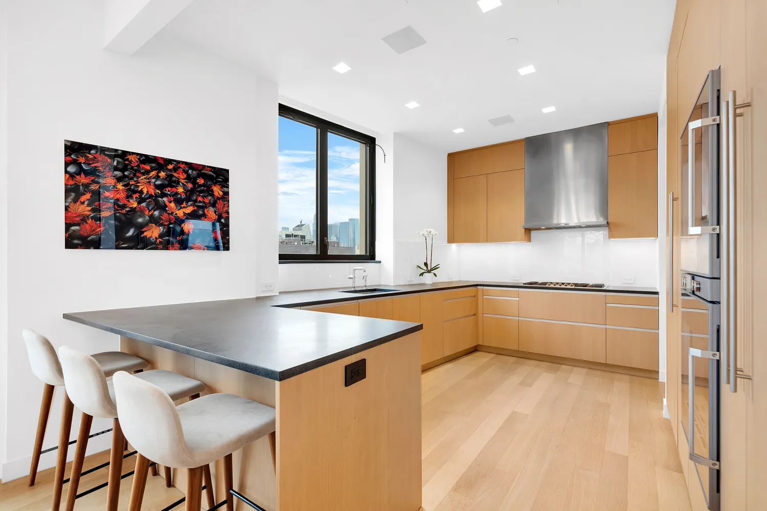 a kitchen with stainless steel appliances granite countertop a granite counter tops and a refrigerator