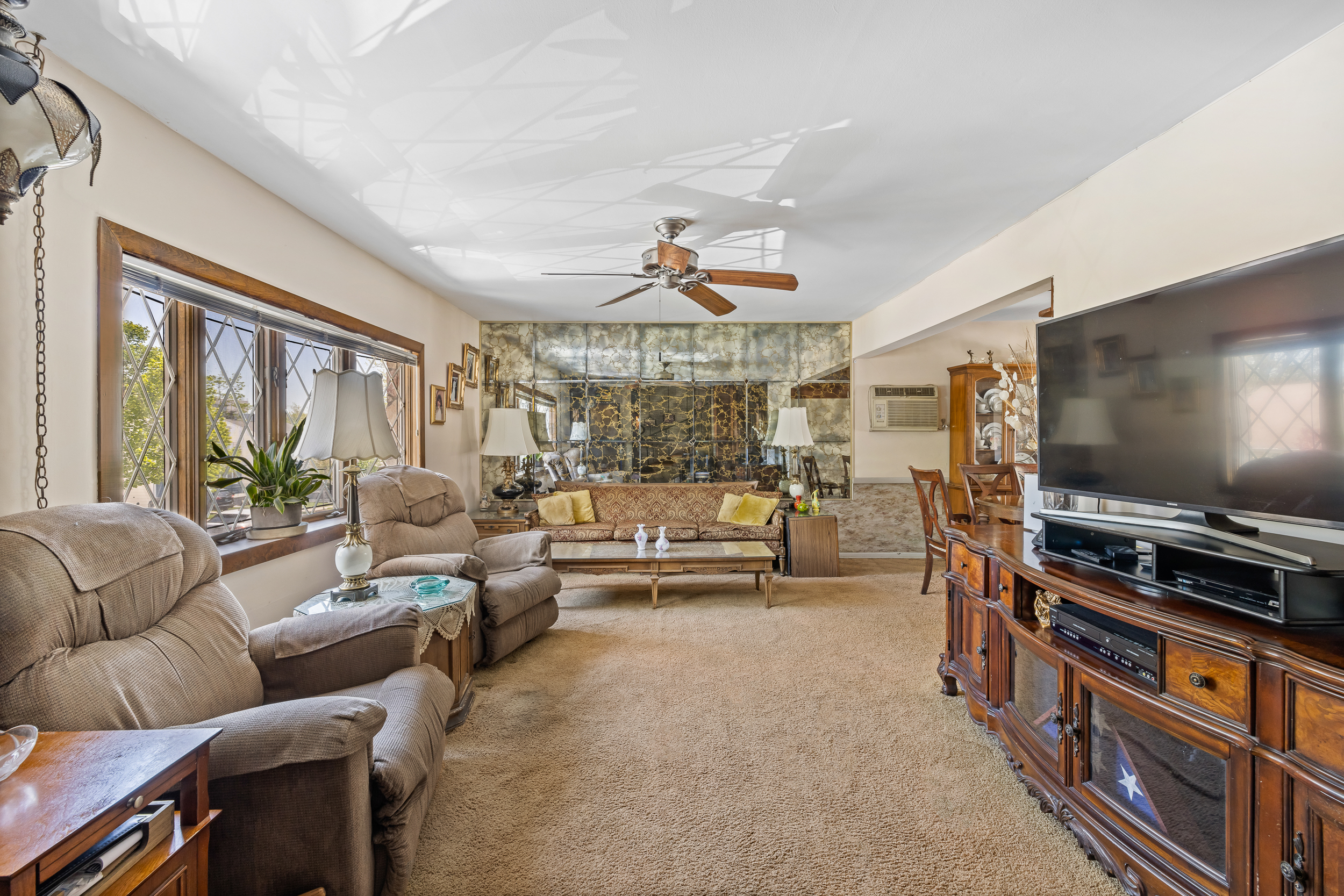 14-28 140th Street Queens, NY 11357 - Photo 3 of 14 a living room with furniture and a flat screen tv