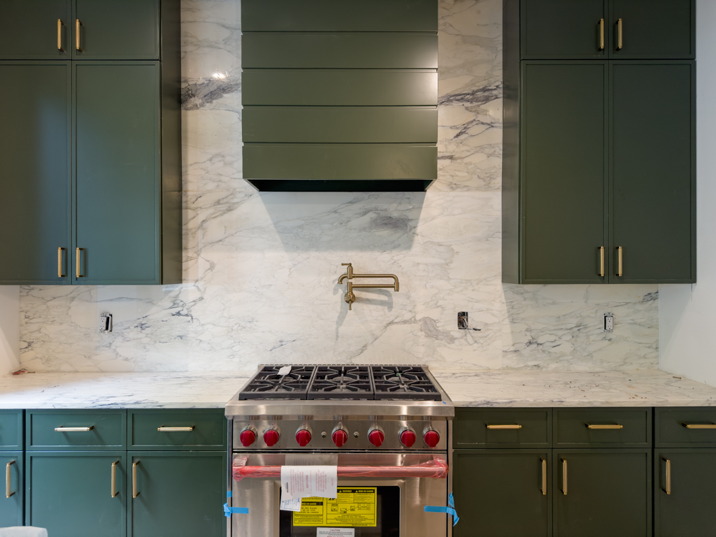 795 Quincy Street Brooklyn, NY 11221 - Photo 3 of 17 a bathroom with a sink a stove and cabinets