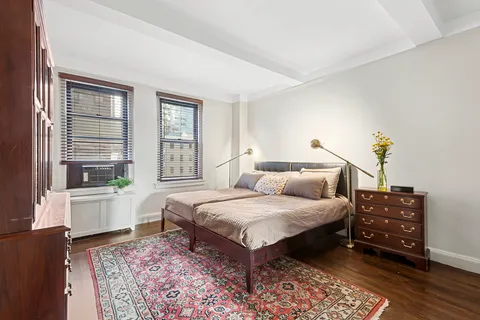 a bedroom with a bed and a couch