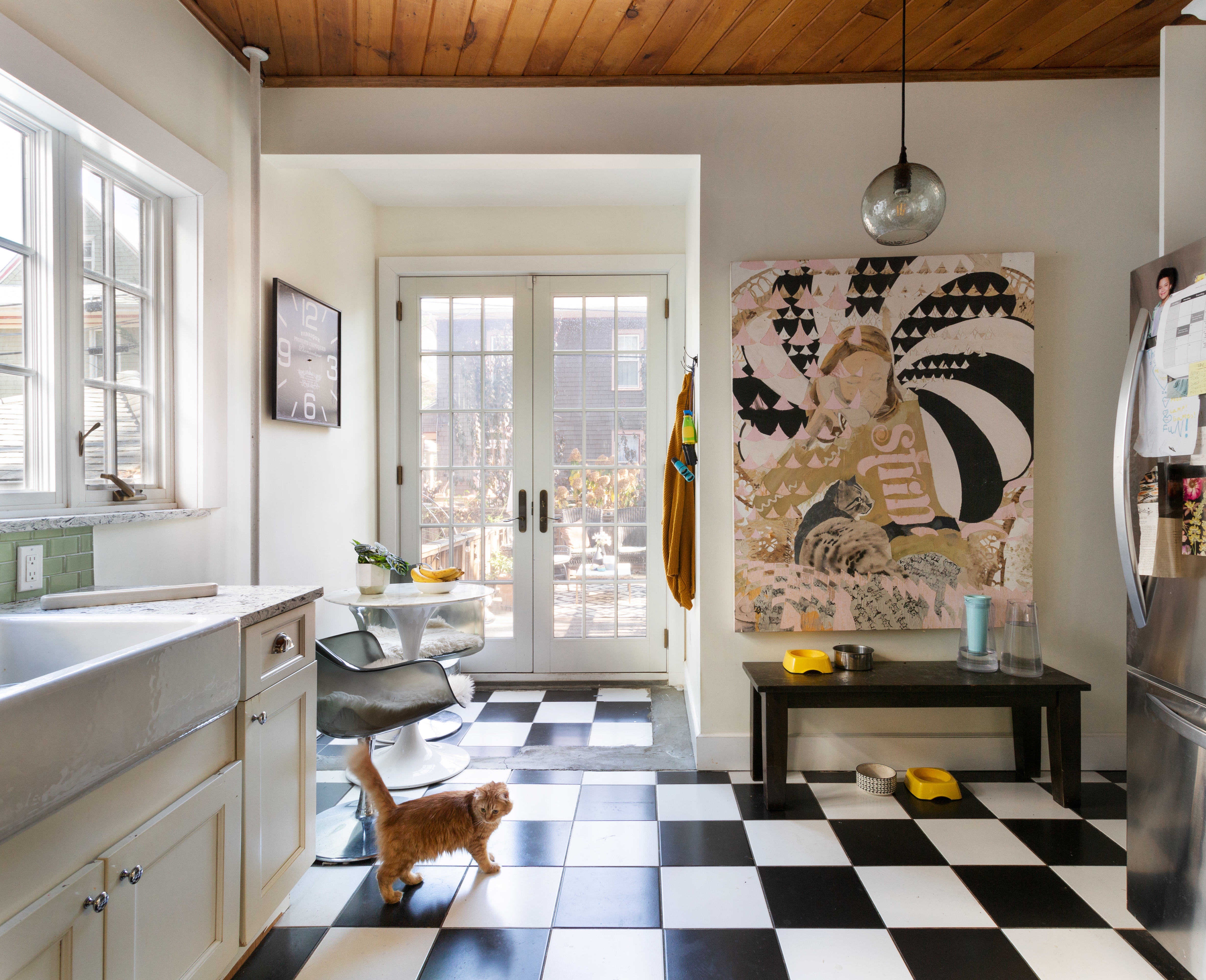 465 Argyle Road Brooklyn, NY 11218 - Photo 11 of 20 a room with a black white checkered floor with a gaming machine and a potted plant