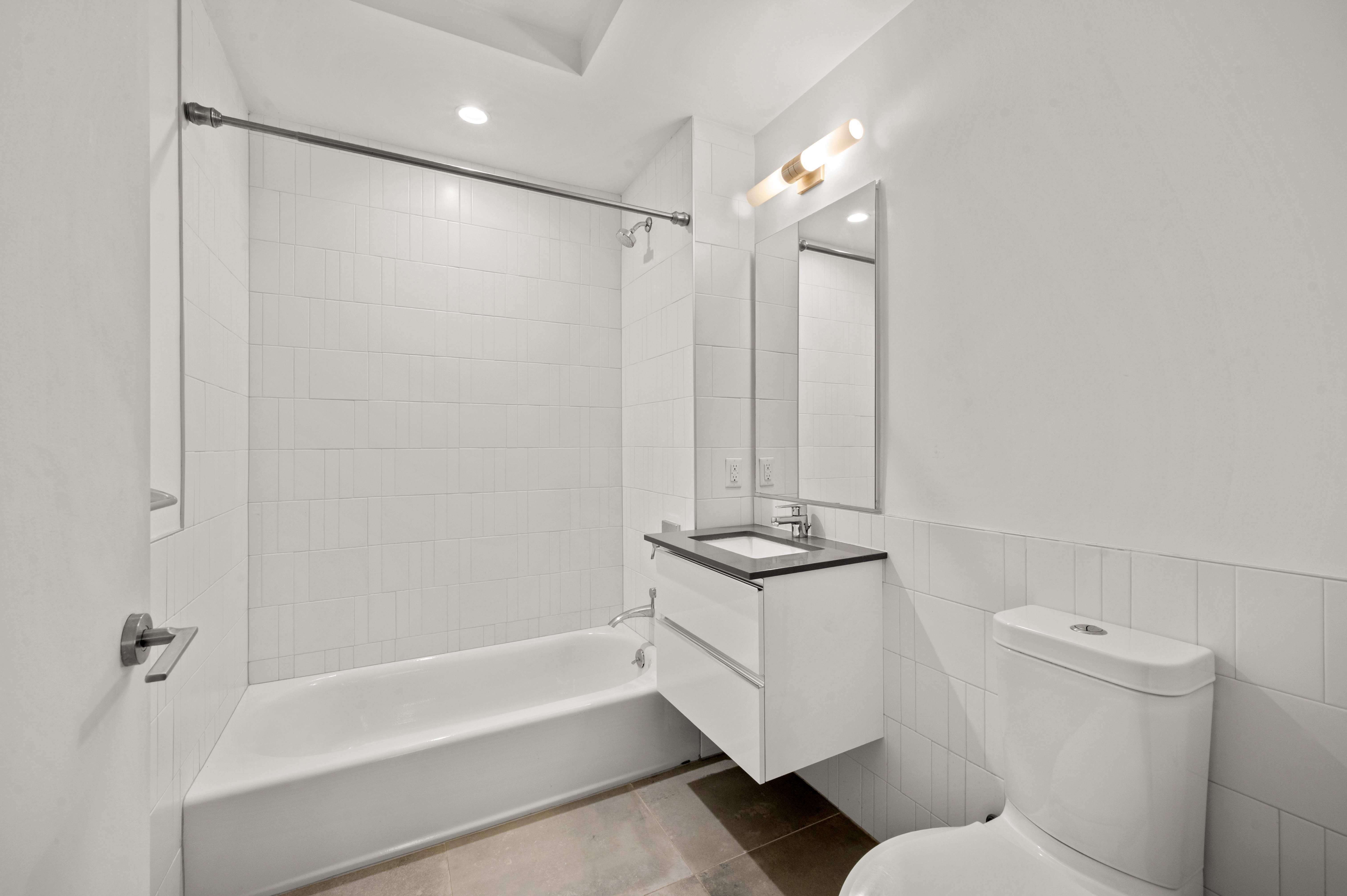 17 Convent Avenue Manhattan, NY 10027 - Photo 13 of 15 a bathroom with a sink a toilet and shower