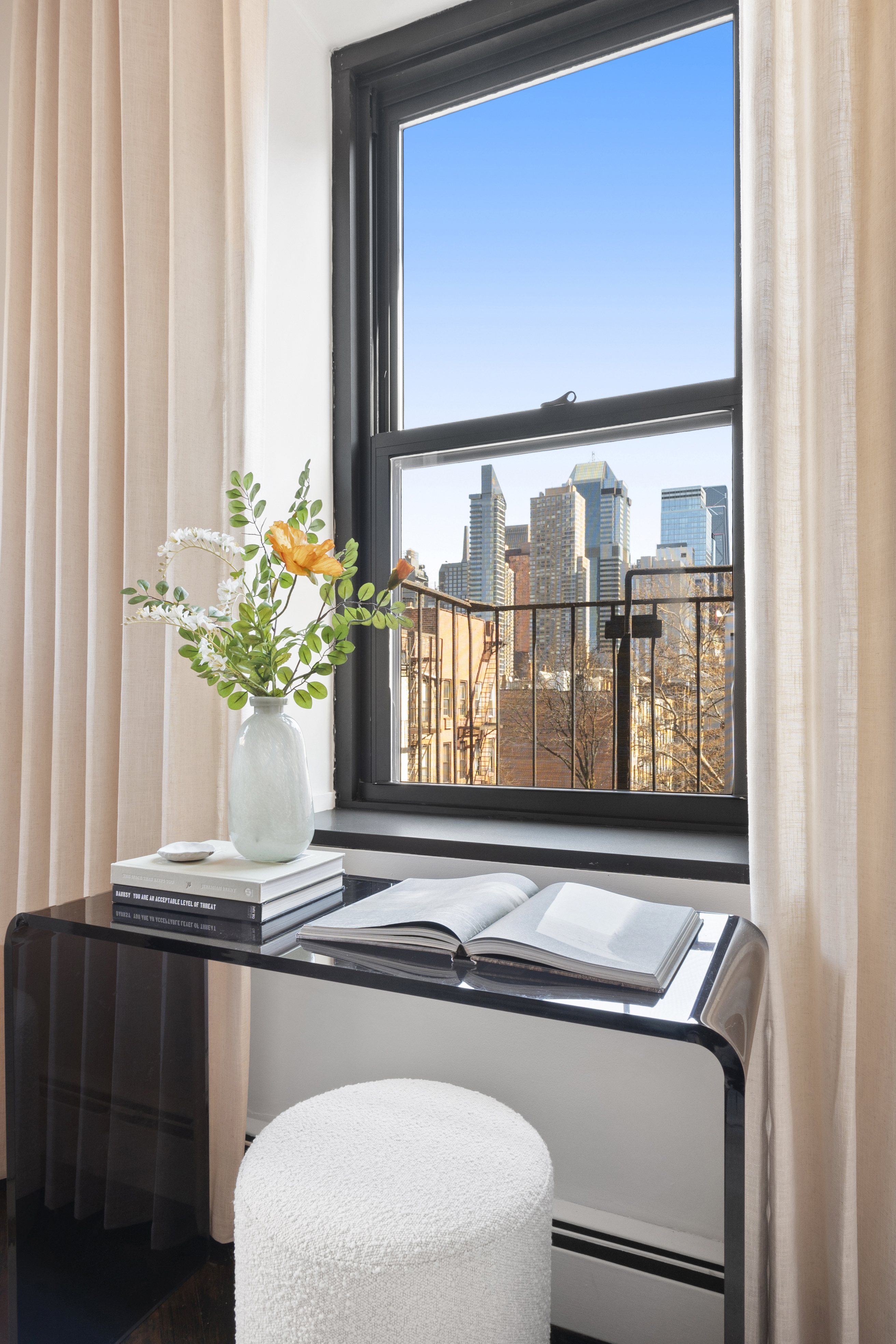 454 West 46th Street, Unit 5CS Manhattan, NY 10036 - Photo 9 of 25 a bathroom with a sink and a mirror