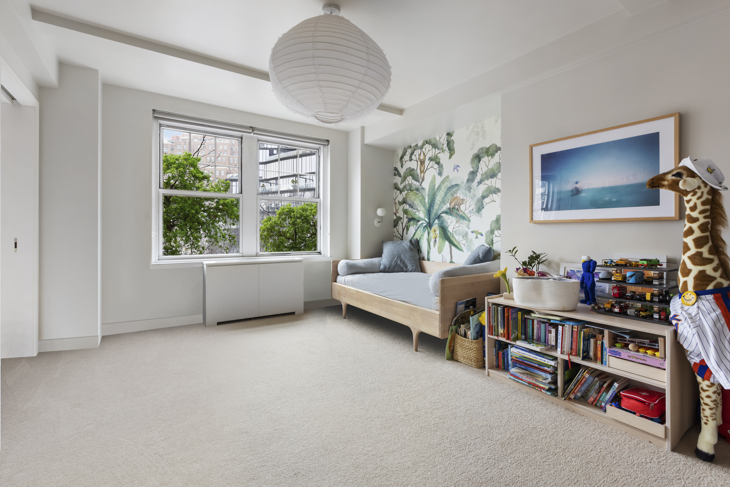 2 Horatio Street, Unit 4JS Manhattan, NY 10014 - Photo 12 of 20 a living room with furniture and a book shelf