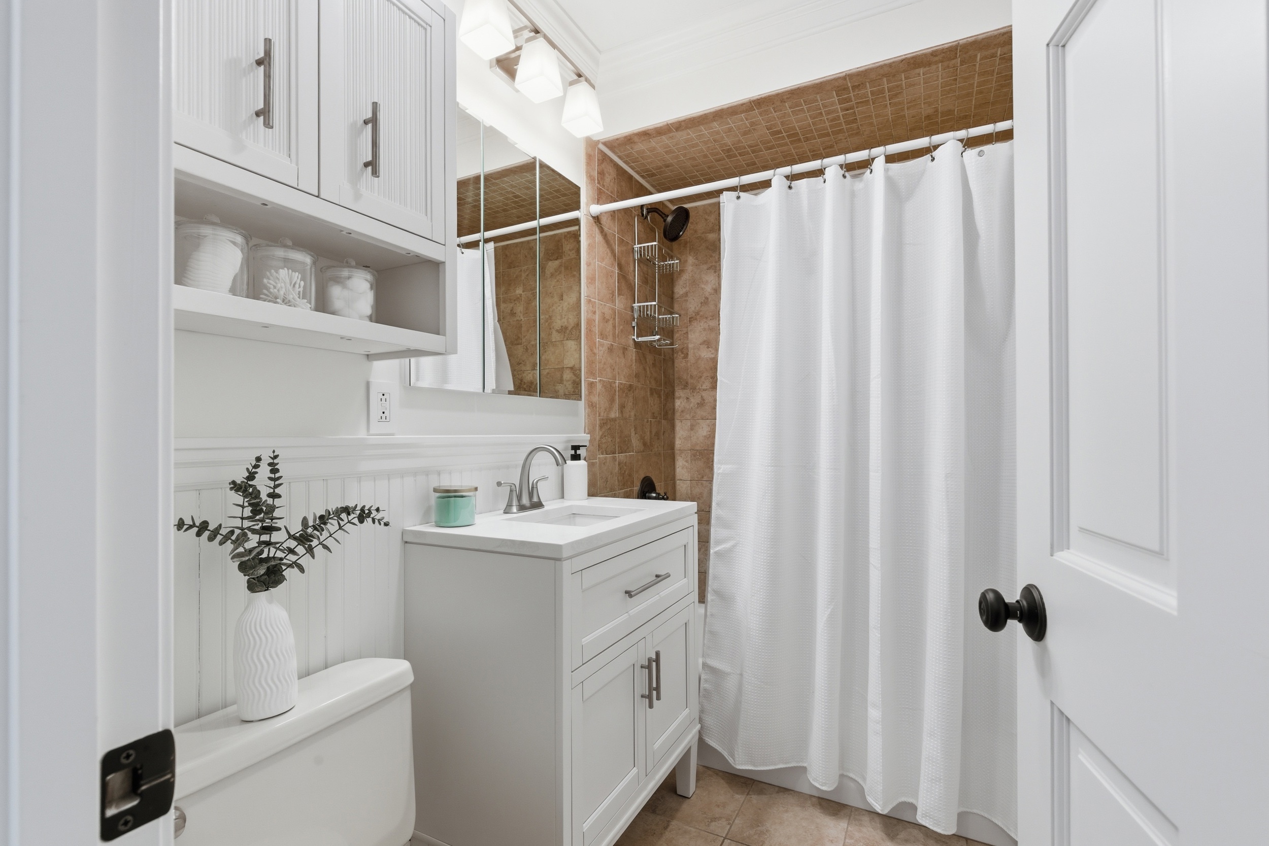48-50 Amsden Street, Unit 2 Arlington, MA 02474 - Photo 31 of 34 a bathroom with a sink a toilet and shower
