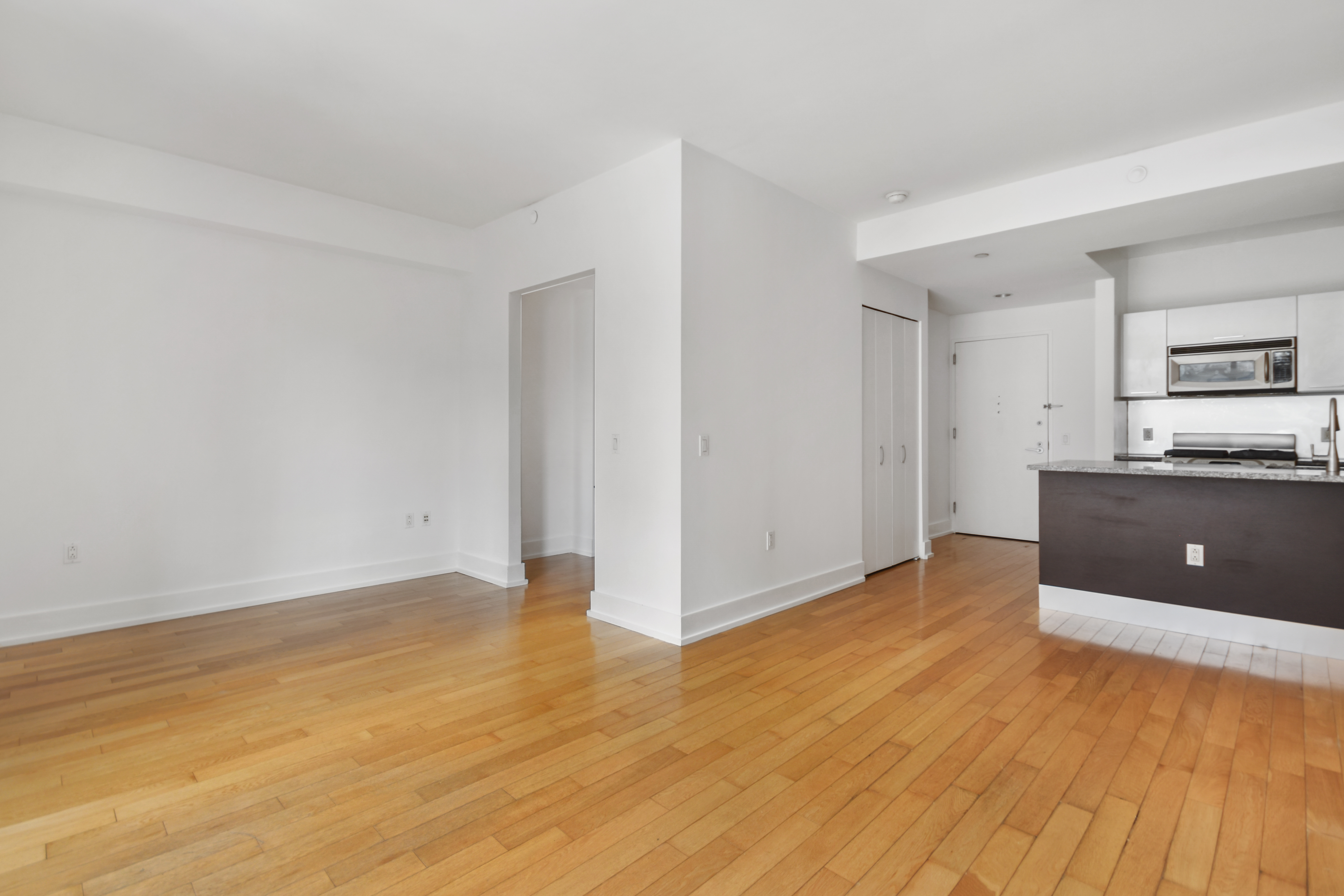 350 West 42nd Street, Unit 8H Manhattan, NY 10036 - Photo 3 of 11 a view of a kitchen with a sink and a stove top oven
