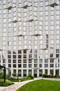 a view of a building with a yard