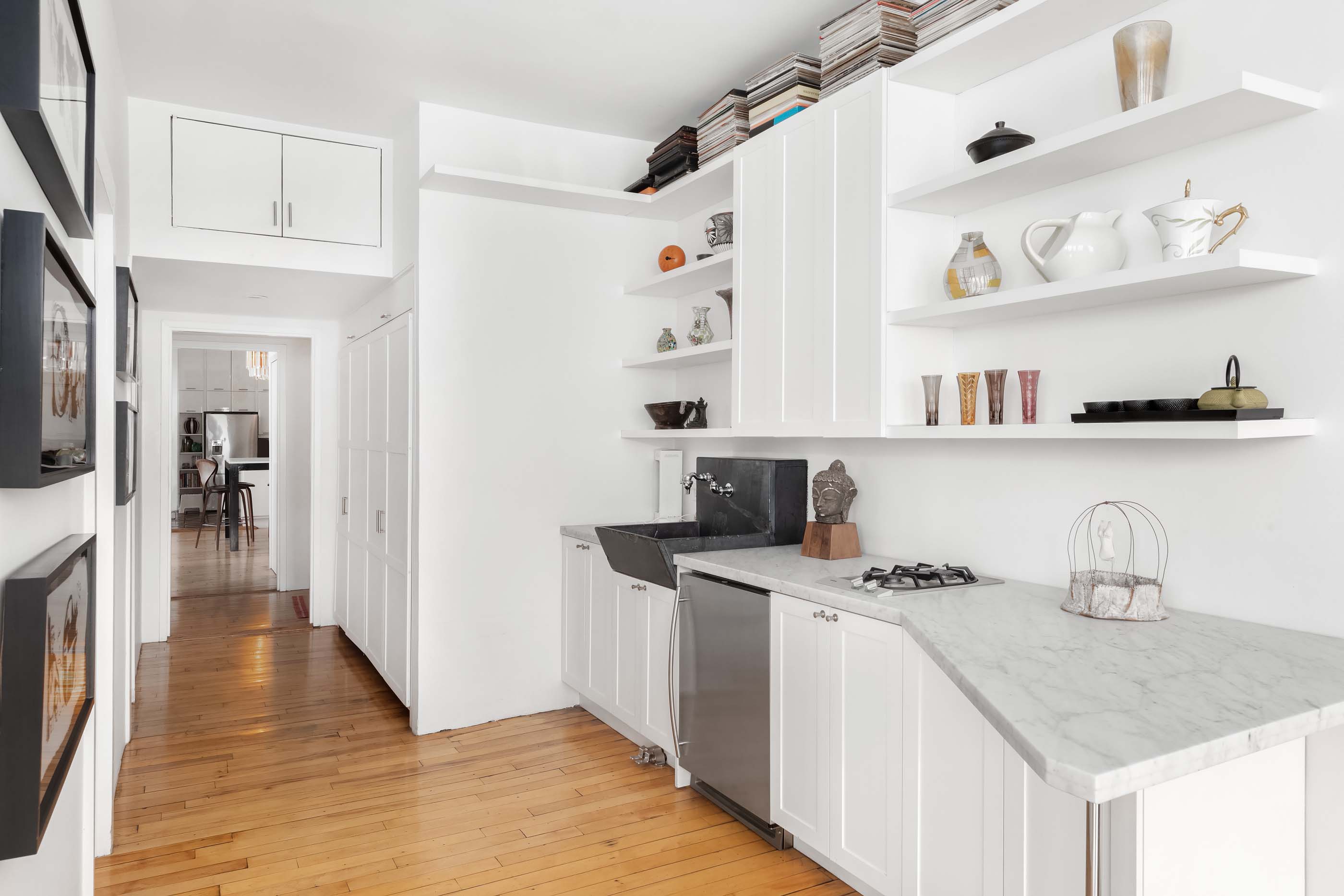 57 Laight Street, Unit 3 Manhattan, NY 10013 - Photo 9 of 15 a kitchen with stainless steel appliances a sink a stove a refrigerator and cabinets