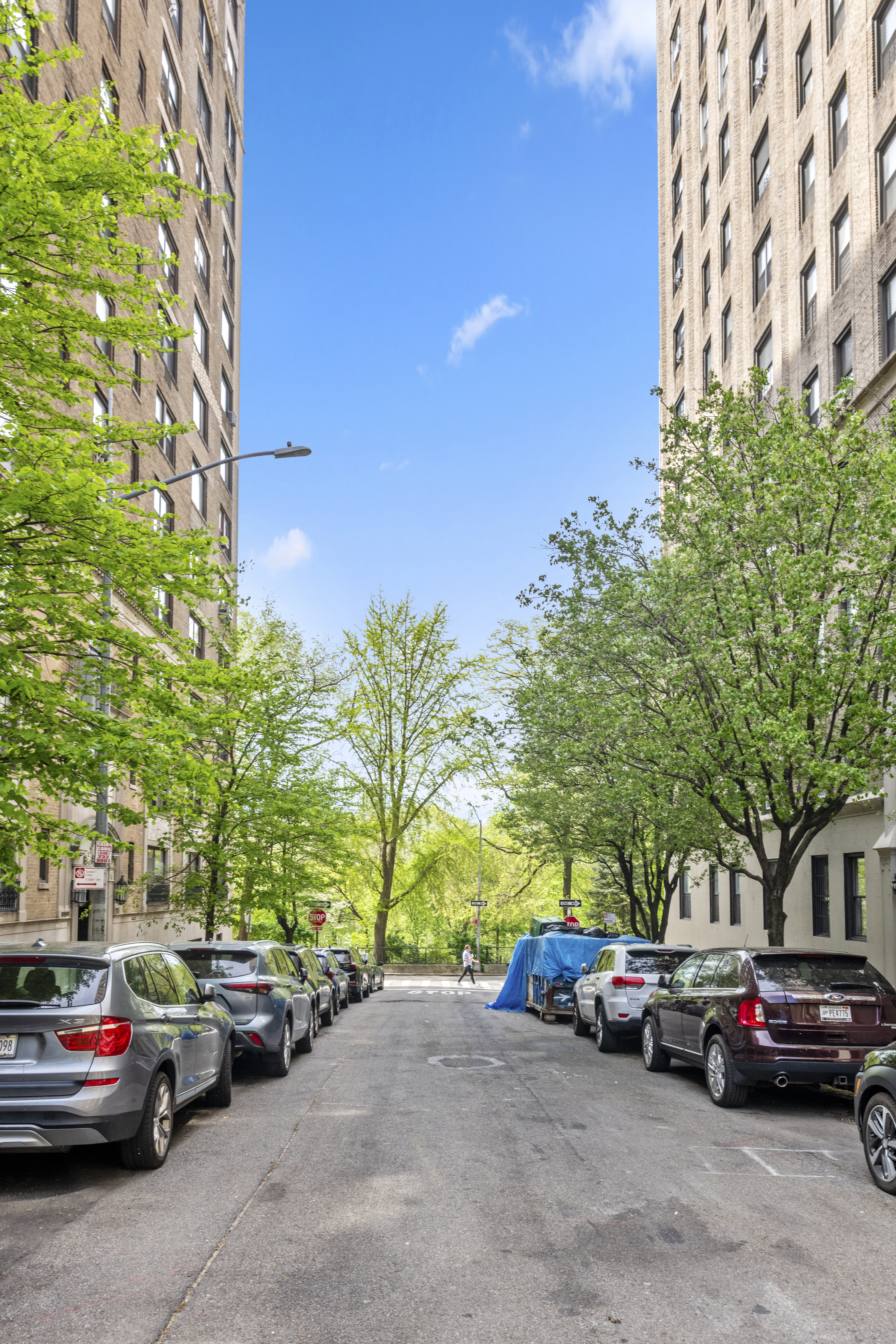 332 West 101st Street, Unit 4F Manhattan, NY 10025 - Photo 8 of 10 a view of street with parked cars