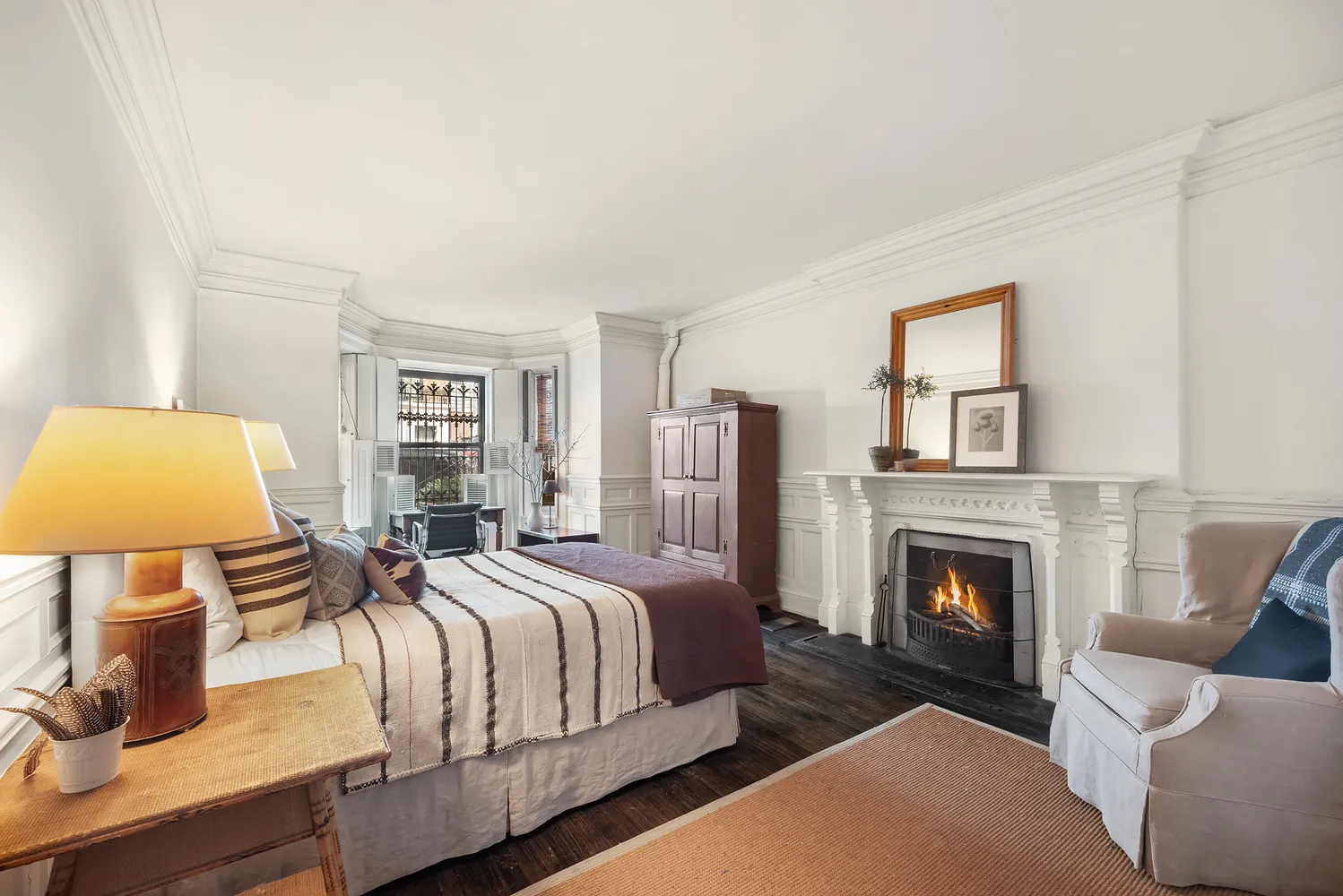 a spacious bedroom with a bed and couch