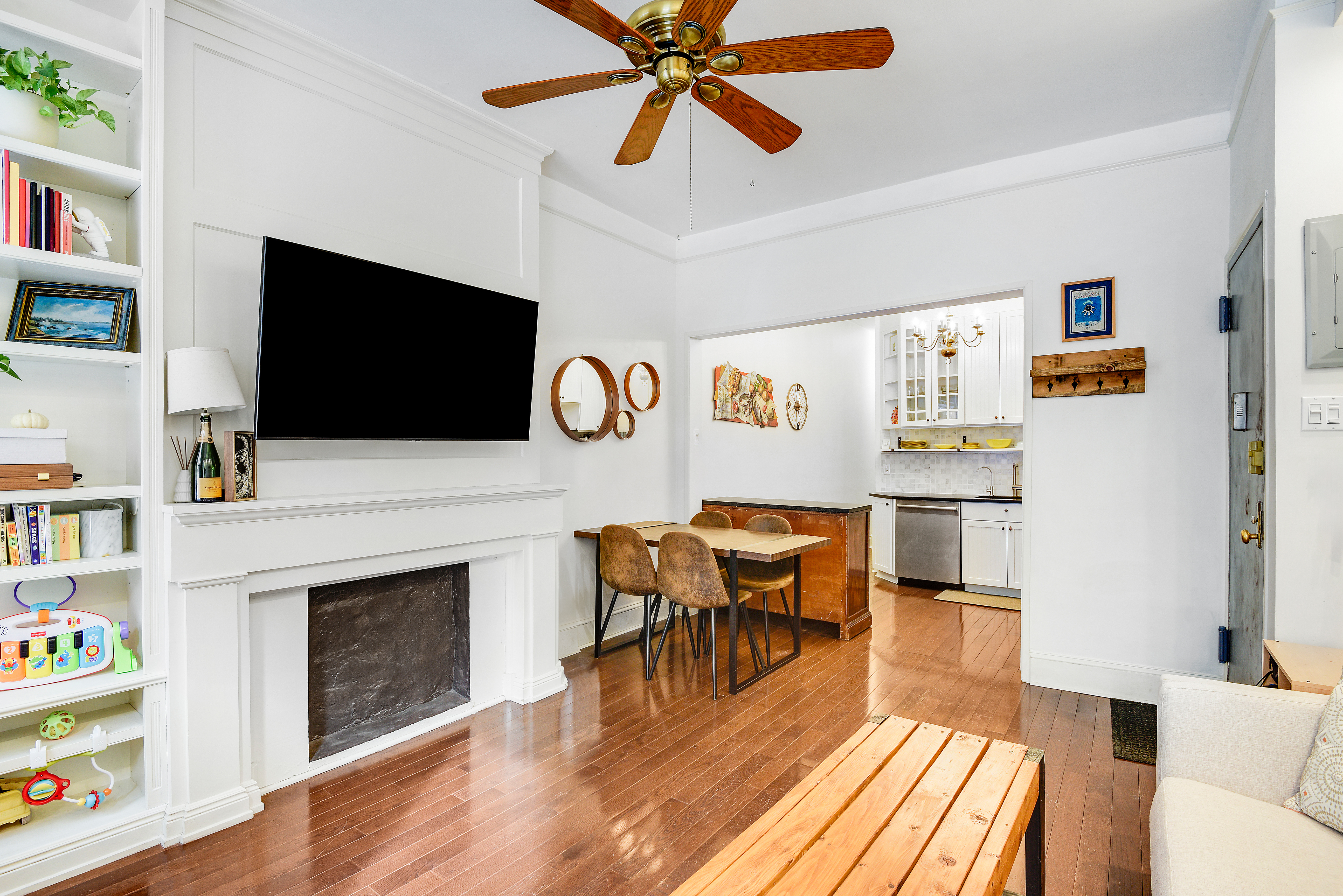 436 East 66th Street, Unit 1W Manhattan, NY 10065 - Photo 5 of 19 a living room with furniture and a flat screen tv