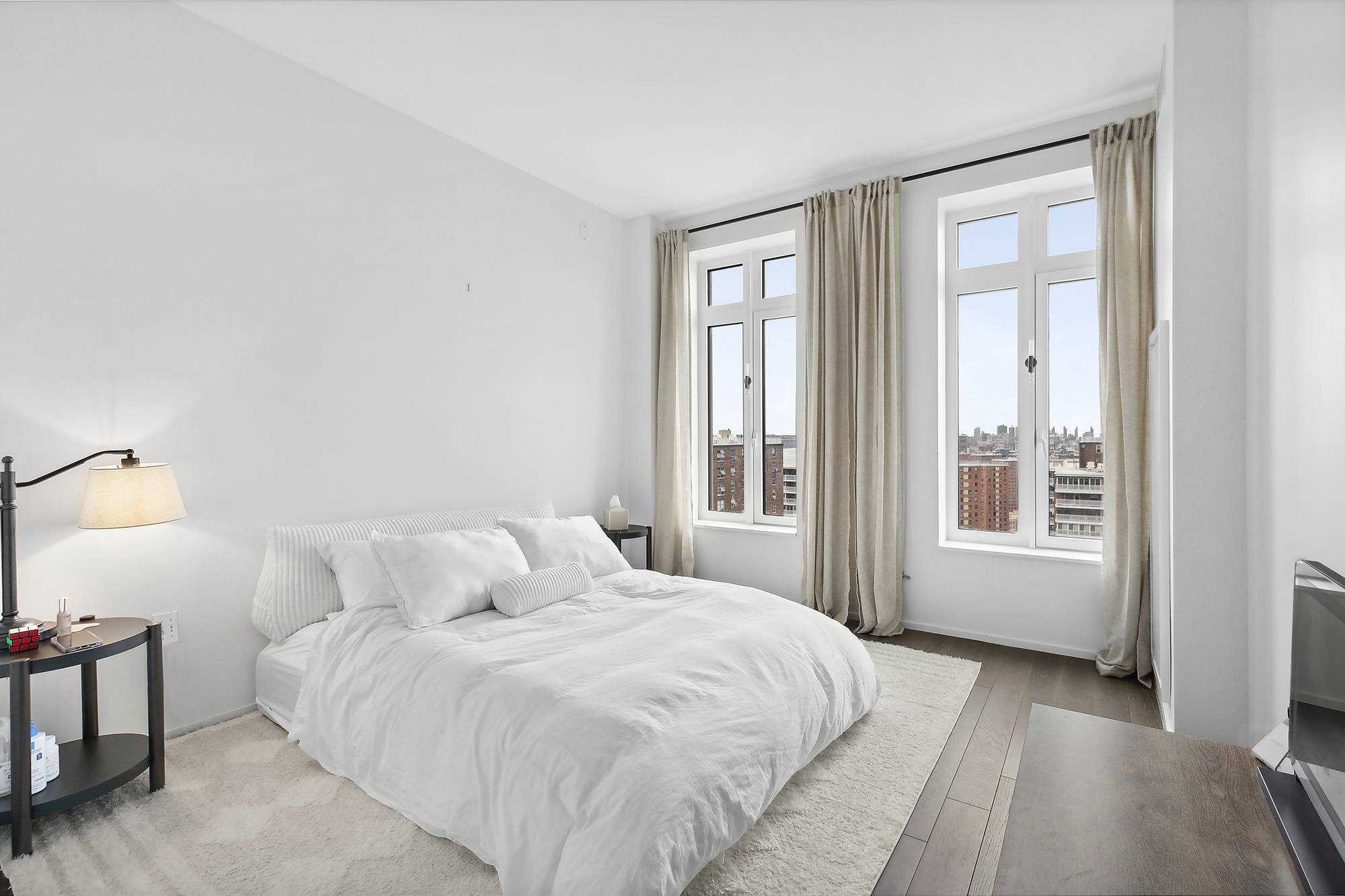 543 West 122nd Street, Unit 17C Manhattan, NY 10027 - Photo 4 of 10 a bedroom with a bed and a window