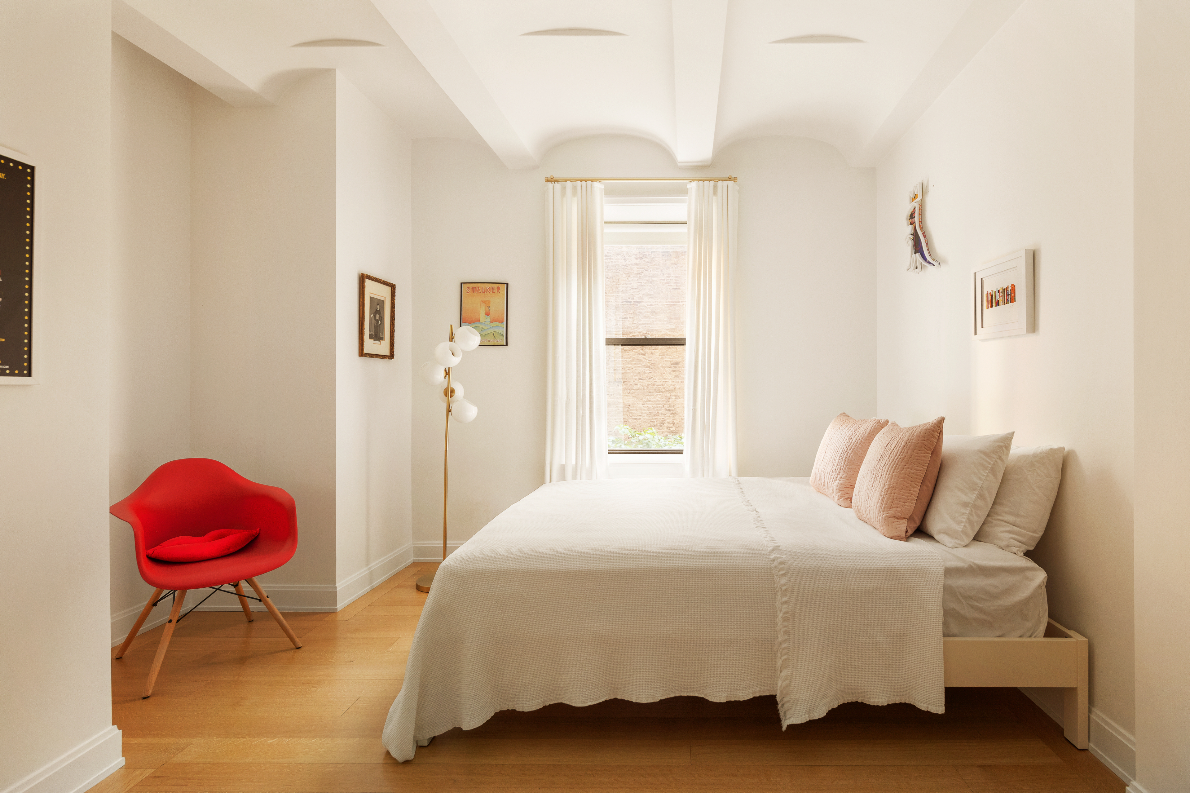 275 West 10th Street, Unit 3B Manhattan, NY 10014 - Photo 7 of 20 a bedroom with a bed and a chair