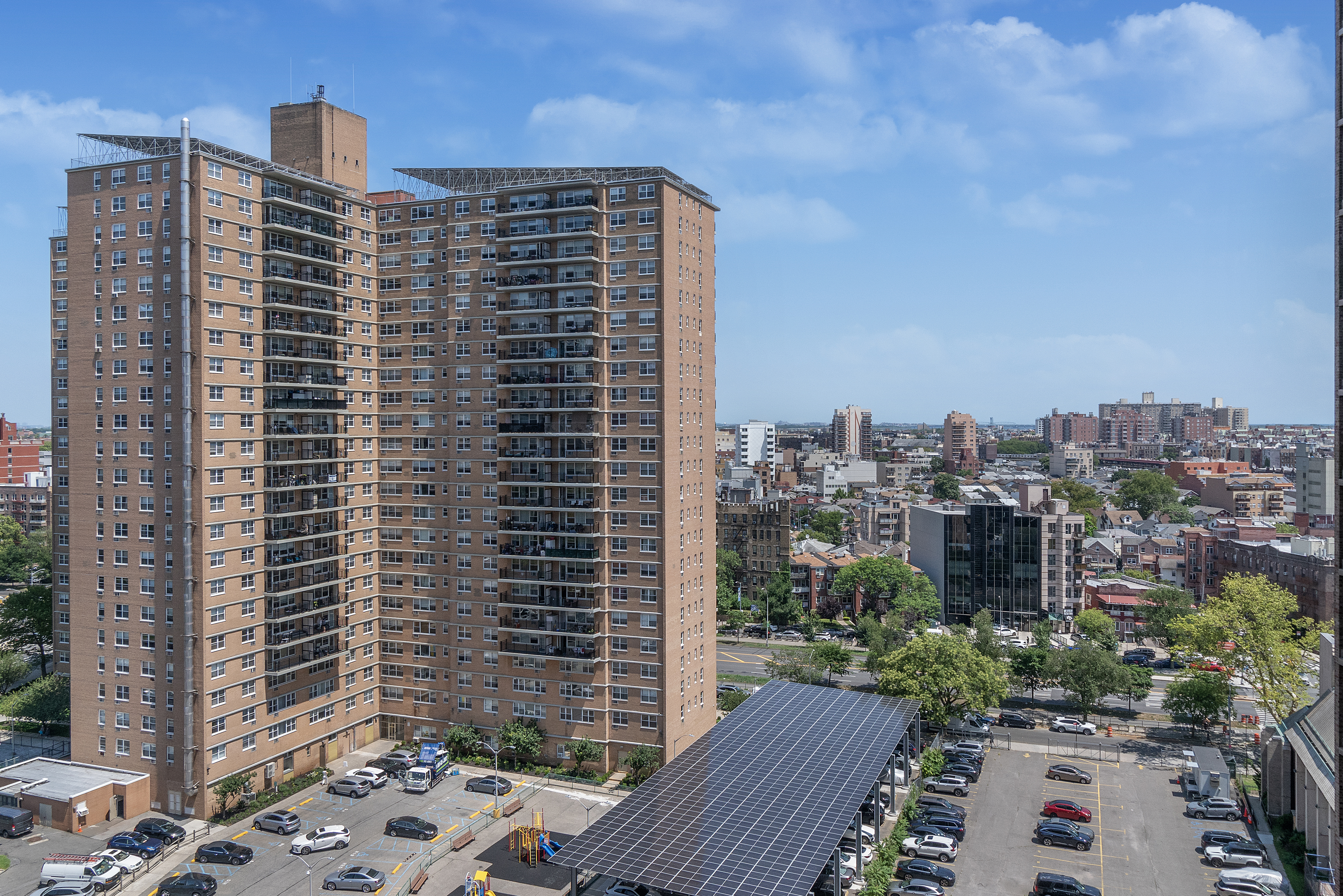 448 Neptune Avenue, Unit 14J Brooklyn, NY 11224 - Photo 20 of 21 a view of a city with tall buildings