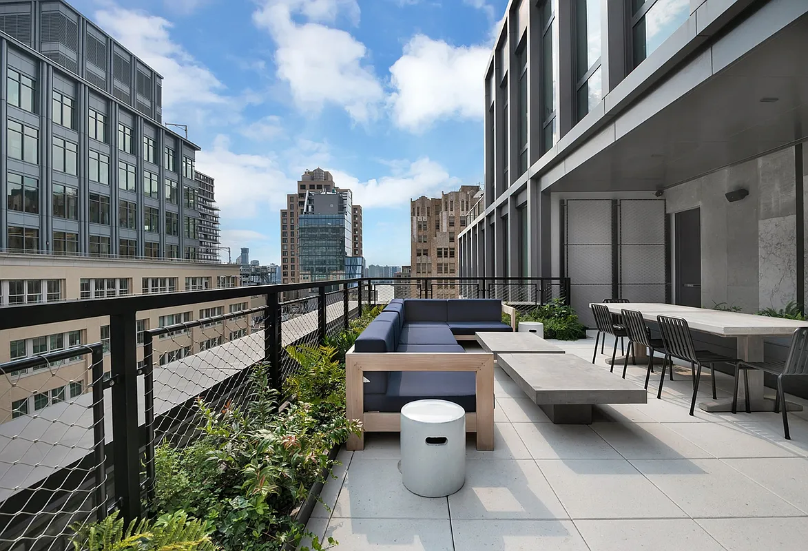 77 Charlton Street, Unit N10C Manhattan, NY 10014 - Photo 18 of 24 a balcony with outdoor seating and plants