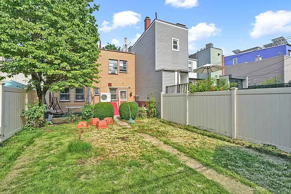 181 Eckford Street Brooklyn, NY 11222 - Photo 4 of 6 front view of a house with a yard