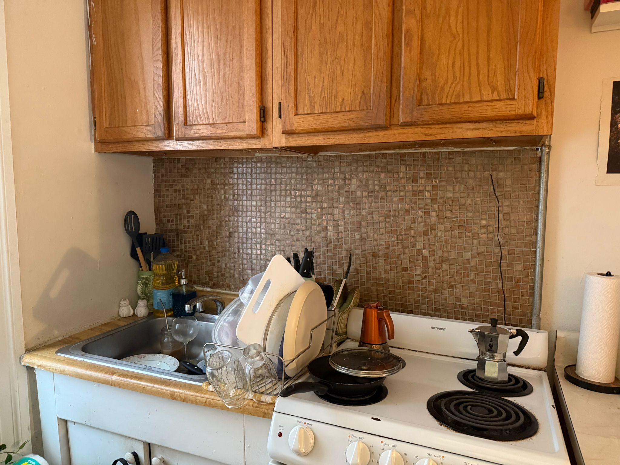 1278 1st Avenue, Unit 2 Manhattan, NY 10065 - Photo 6 of 19 a kitchen with a sink and cabinets