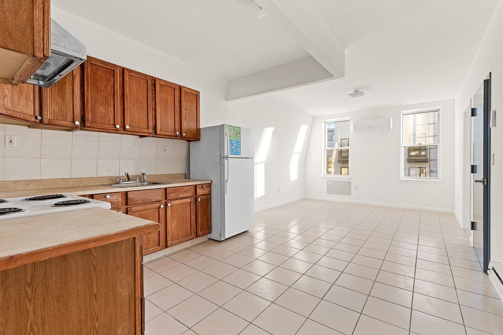 1644 Atlantic Avenue Brooklyn, NY 11213 - Photo 6 of 17 a kitchen with stainless steel appliances granite countertop a stove a sink and a refrigerator