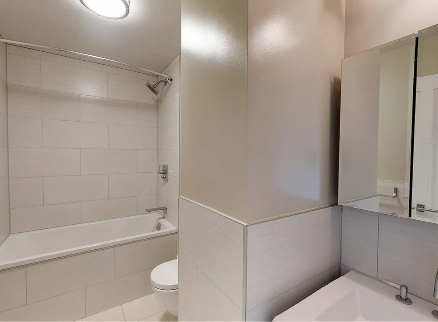 40 Harrison Street, Unit 24H Manhattan, NY 10013 - Photo 13 of 17 a bathroom with a shower and a toilet