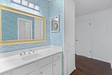a bathroom with a sink and a mirror