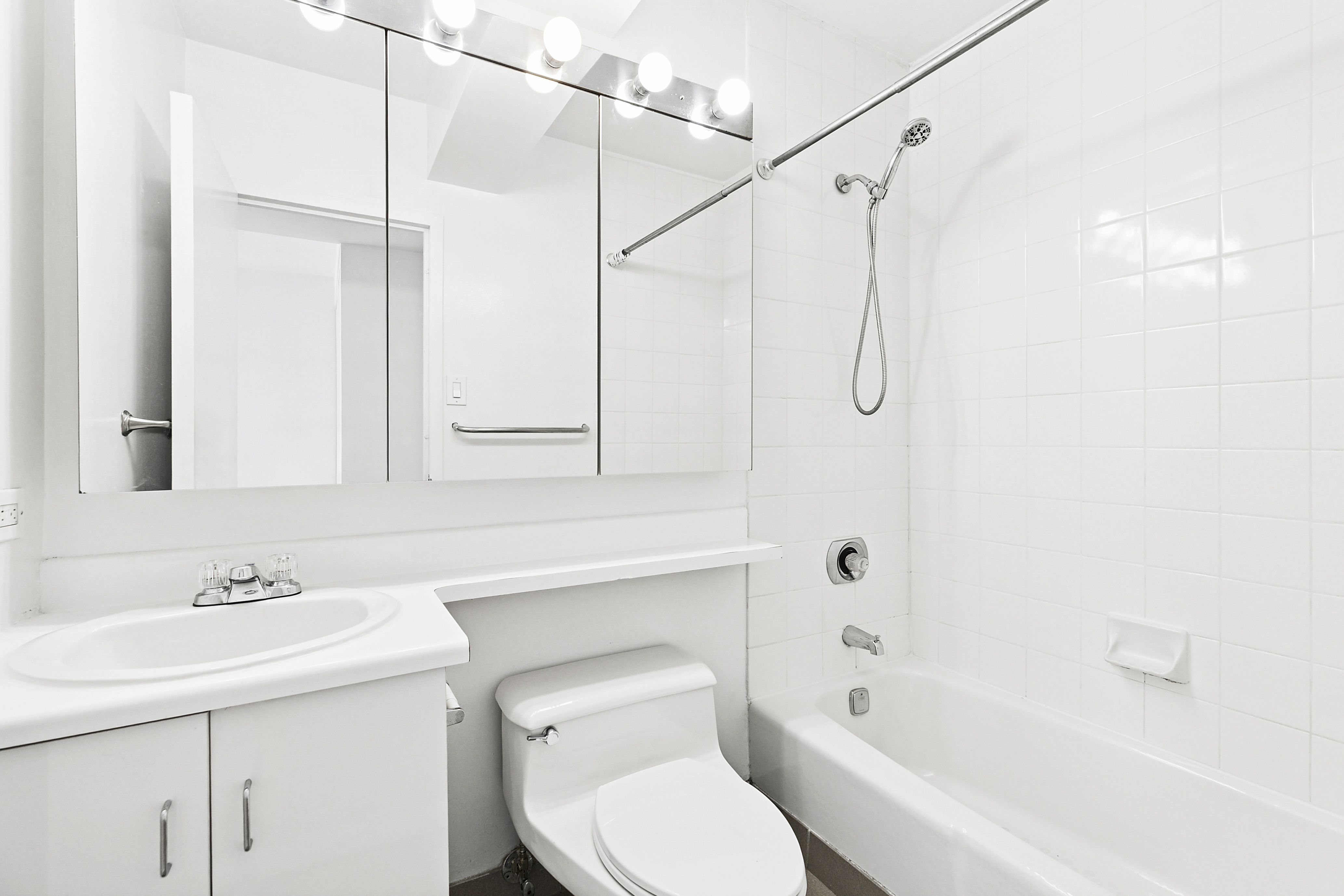 2250 Broadway, Unit 6K Manhattan, NY 10024 - Photo 11 of 15 a bathroom with a sink a toilet and shower