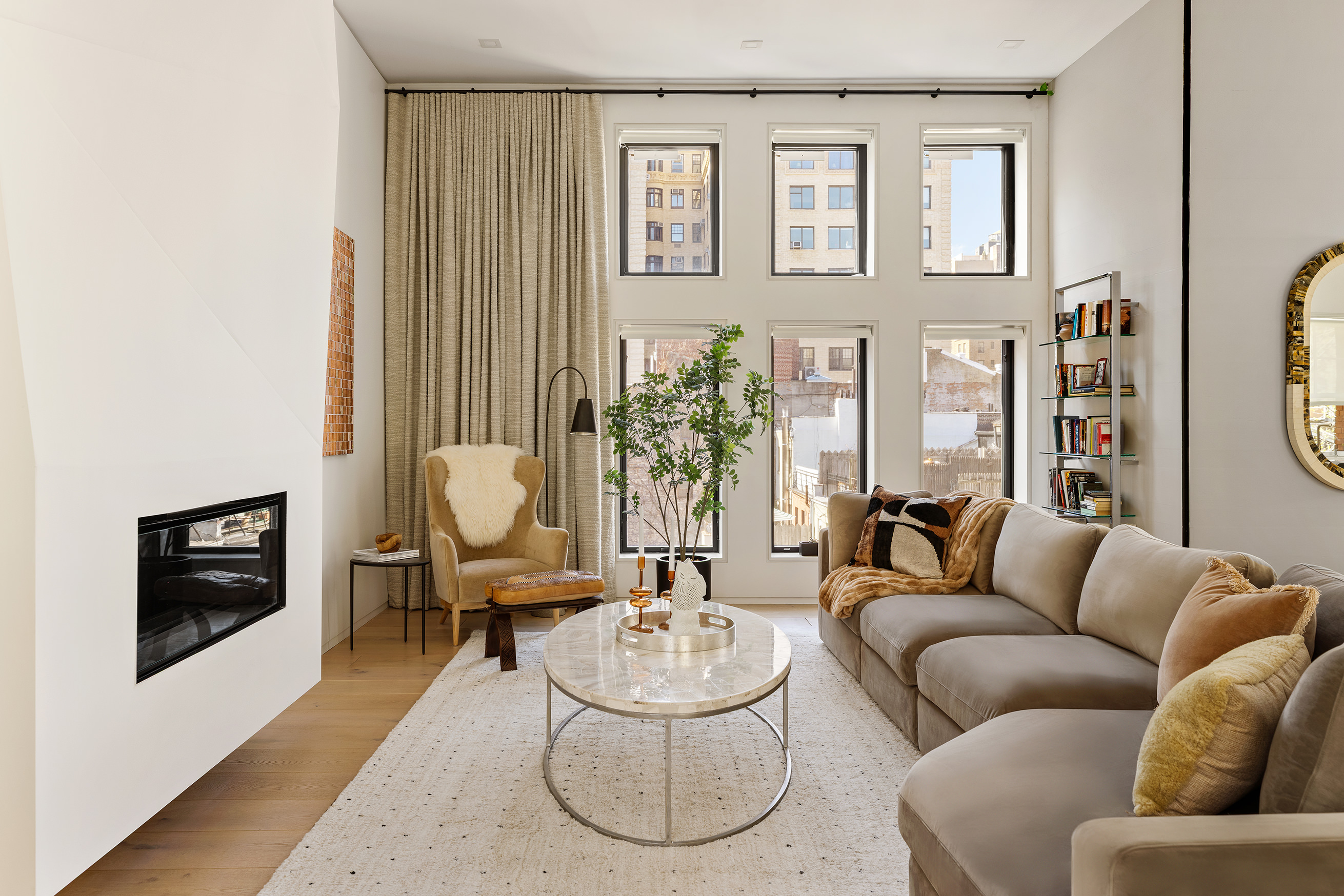 272 West 91st Street Manhattan, NY 10024 - Photo 3 of 30 a living room with furniture and a fireplace