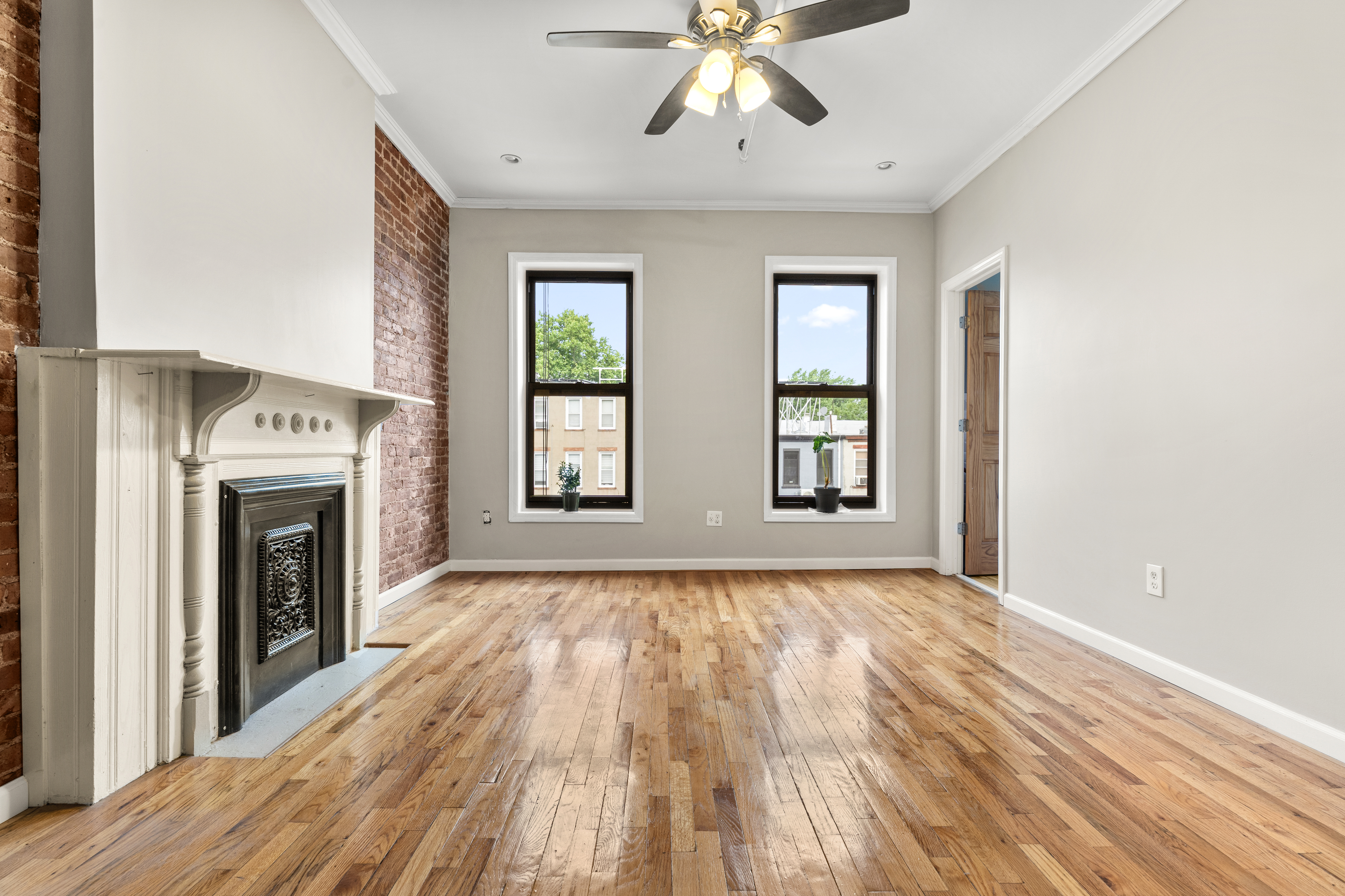 615 Putnam Avenue, Unit 4 Brooklyn, NY 11221 - Photo 9 of 10 a view of an empty room with wooden floor and a window