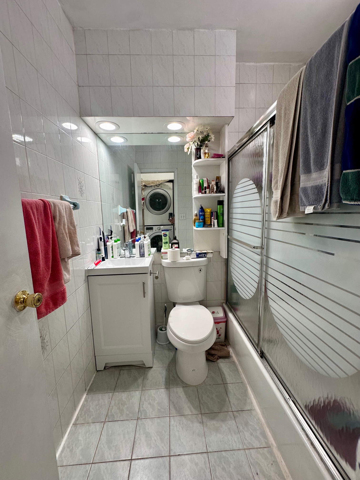 41-34 39th Street Queens, NY 11101 - Photo 7 of 10 a bathroom with a toilet sink and mirror