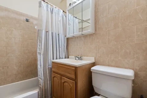 a bathroom with a toilet a sink and a bathtub