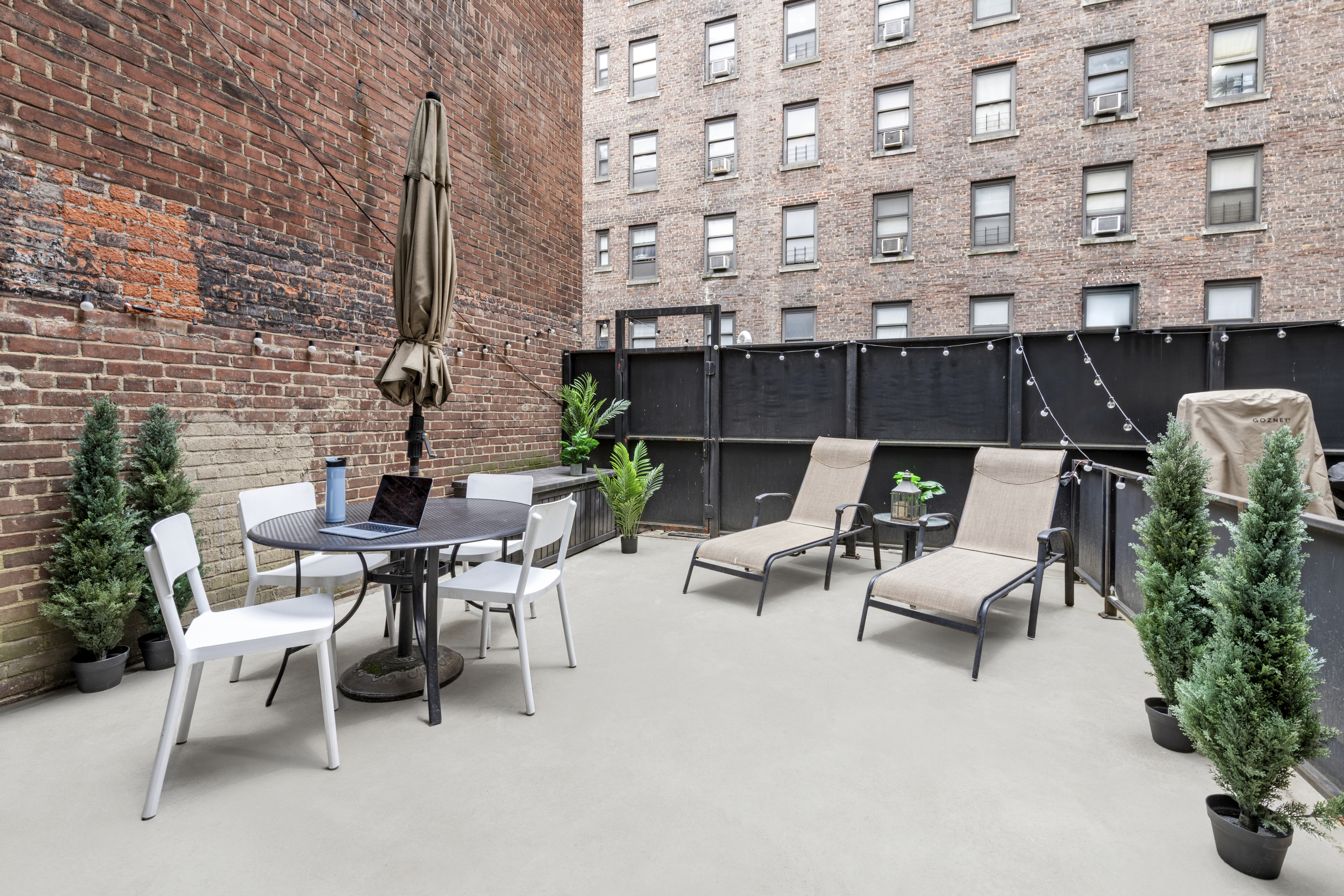 148 East 24th Street, Unit 3D Manhattan, NY 10010 - Photo 6 of 15 a view of a patio with a table and chairs in patio