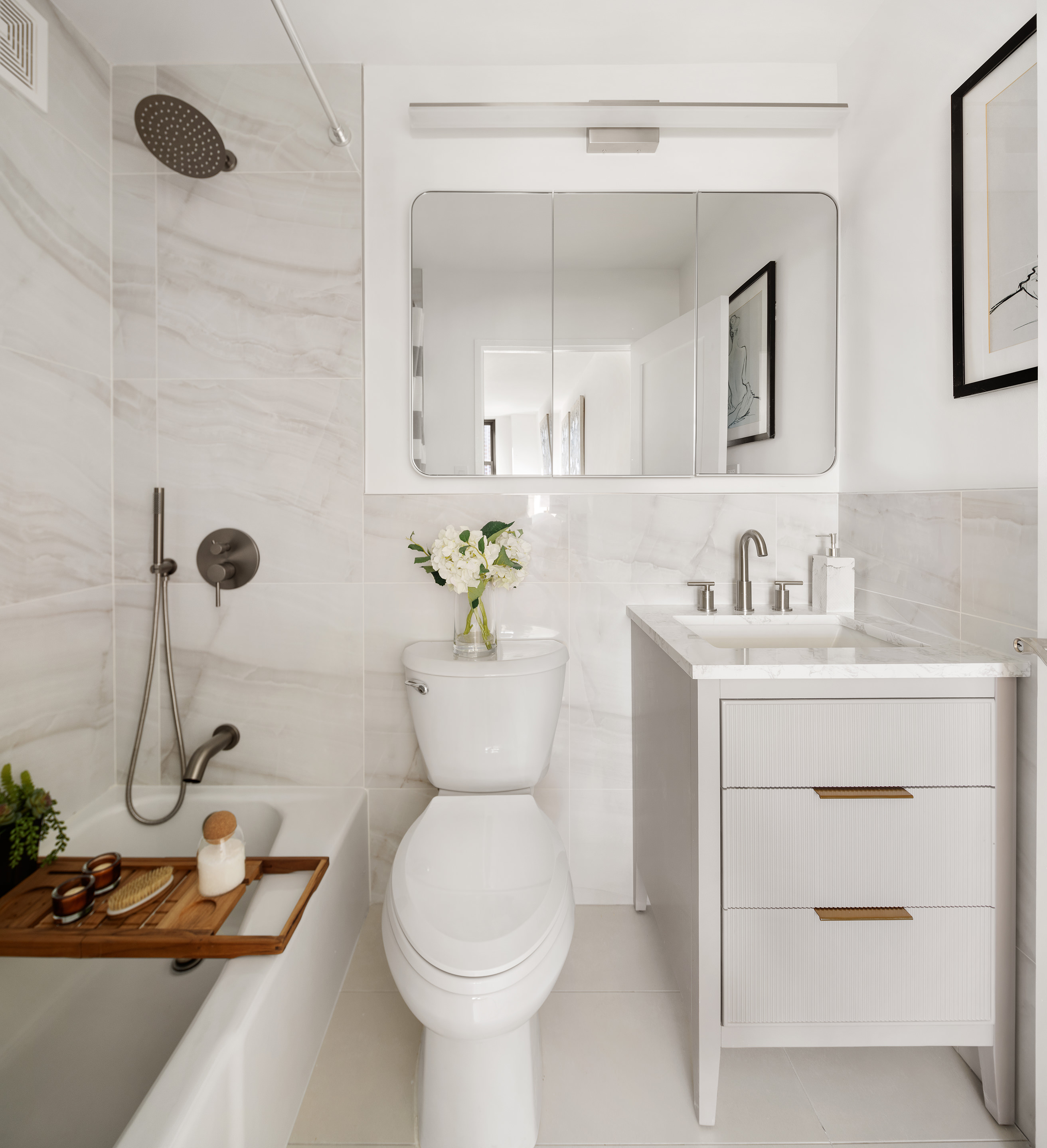 200 East 90th Street, Unit 12F Manhattan, NY 10128 - Photo 5 of 13 a bathroom with a sink toilet and shower