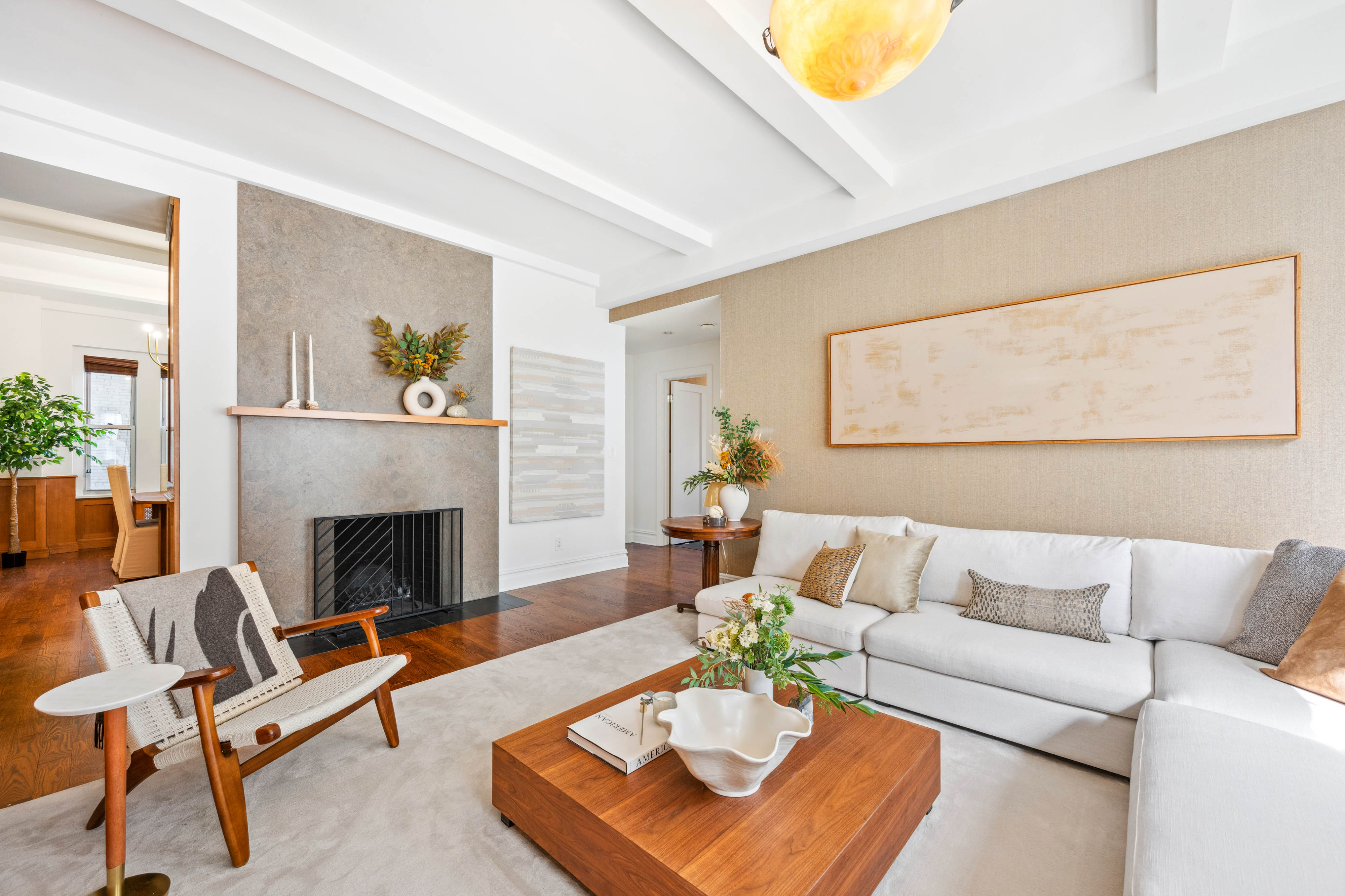 25 5th Avenue, Unit 6C Manhattan, NY 10003 - Photo 2 of 16 a living room with furniture and a fireplace