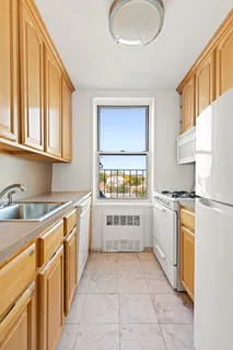 a kitchen with a refrigerator and a sink