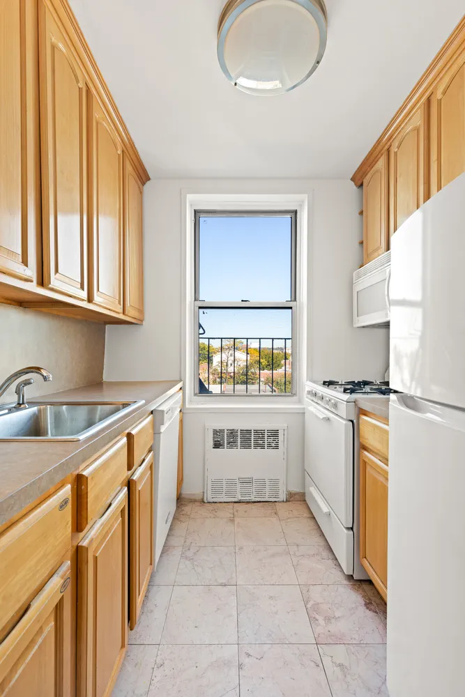 a kitchen with a refrigerator and a sink