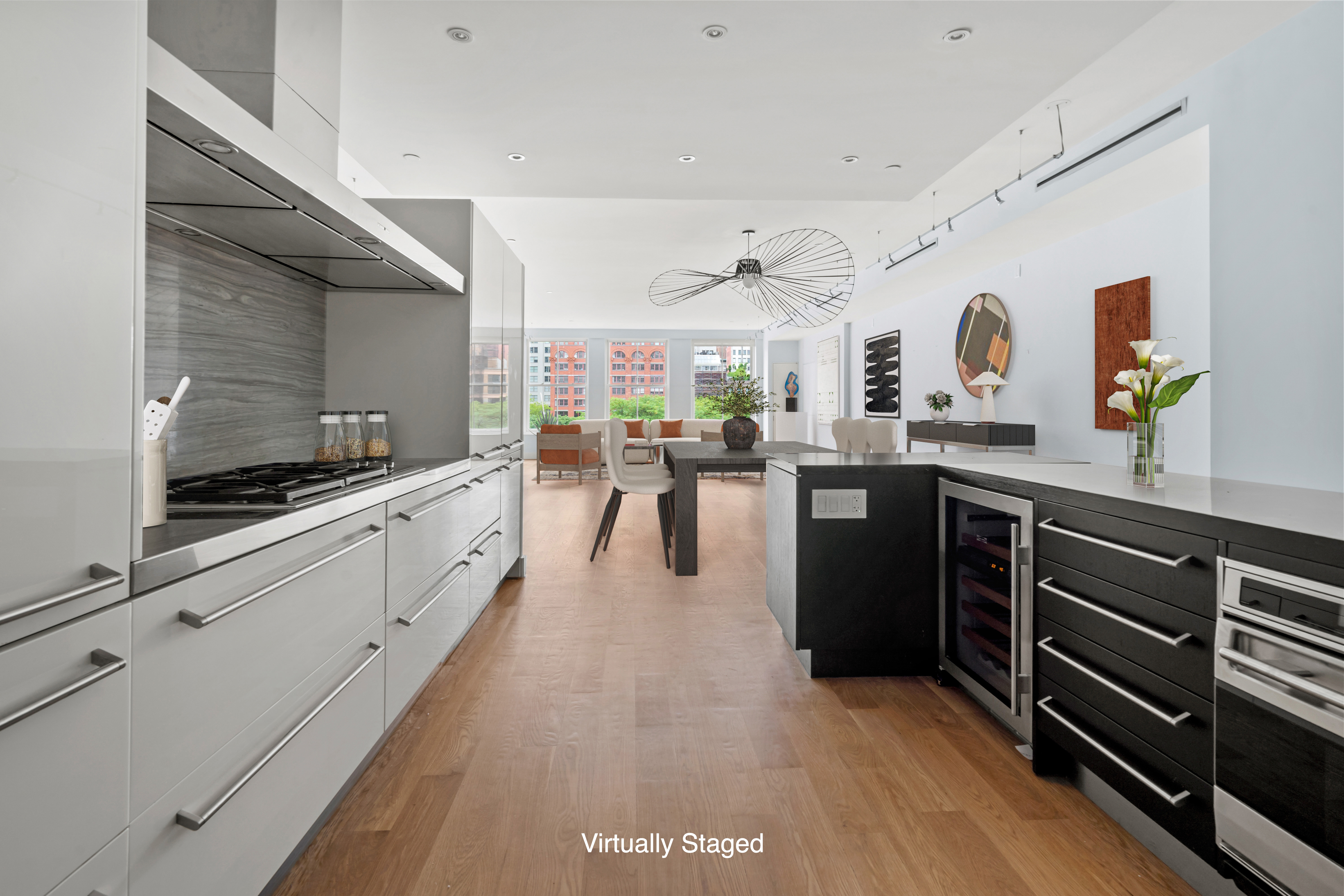 32 Laight Street, Unit 5 Manhattan, NY 10013 - Photo 13 of 31 a kitchen with stainless steel appliances kitchen island granite countertop a stove and cabinets