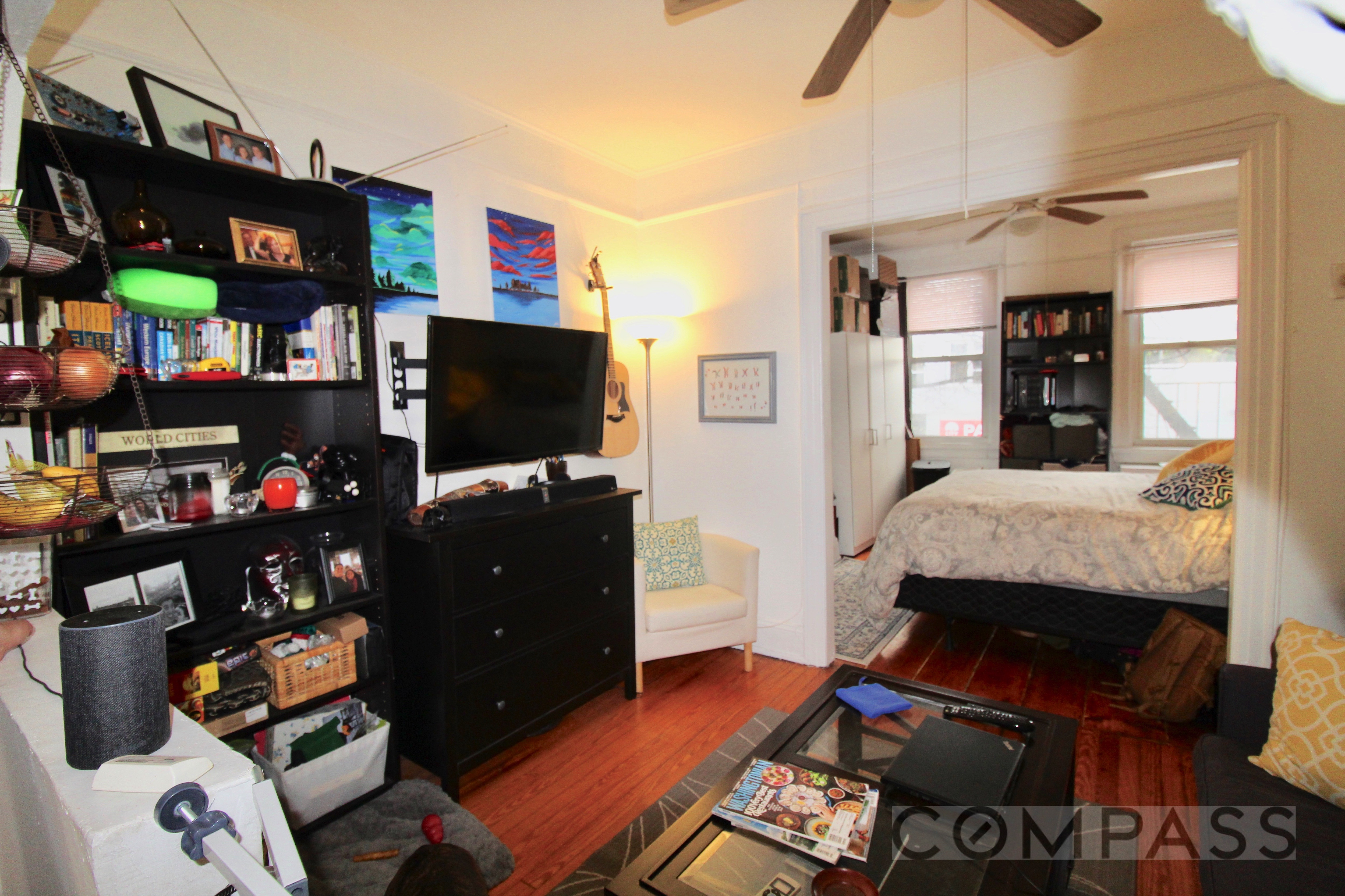 a living room with furniture and a flat screen tv