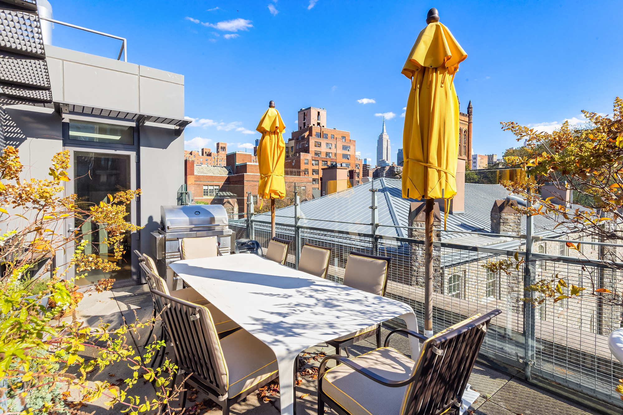 455 West 20th Street, Unit PH Manhattan, NY 10011 - Photo 2 of 21 a view of a patio with a table and chairs