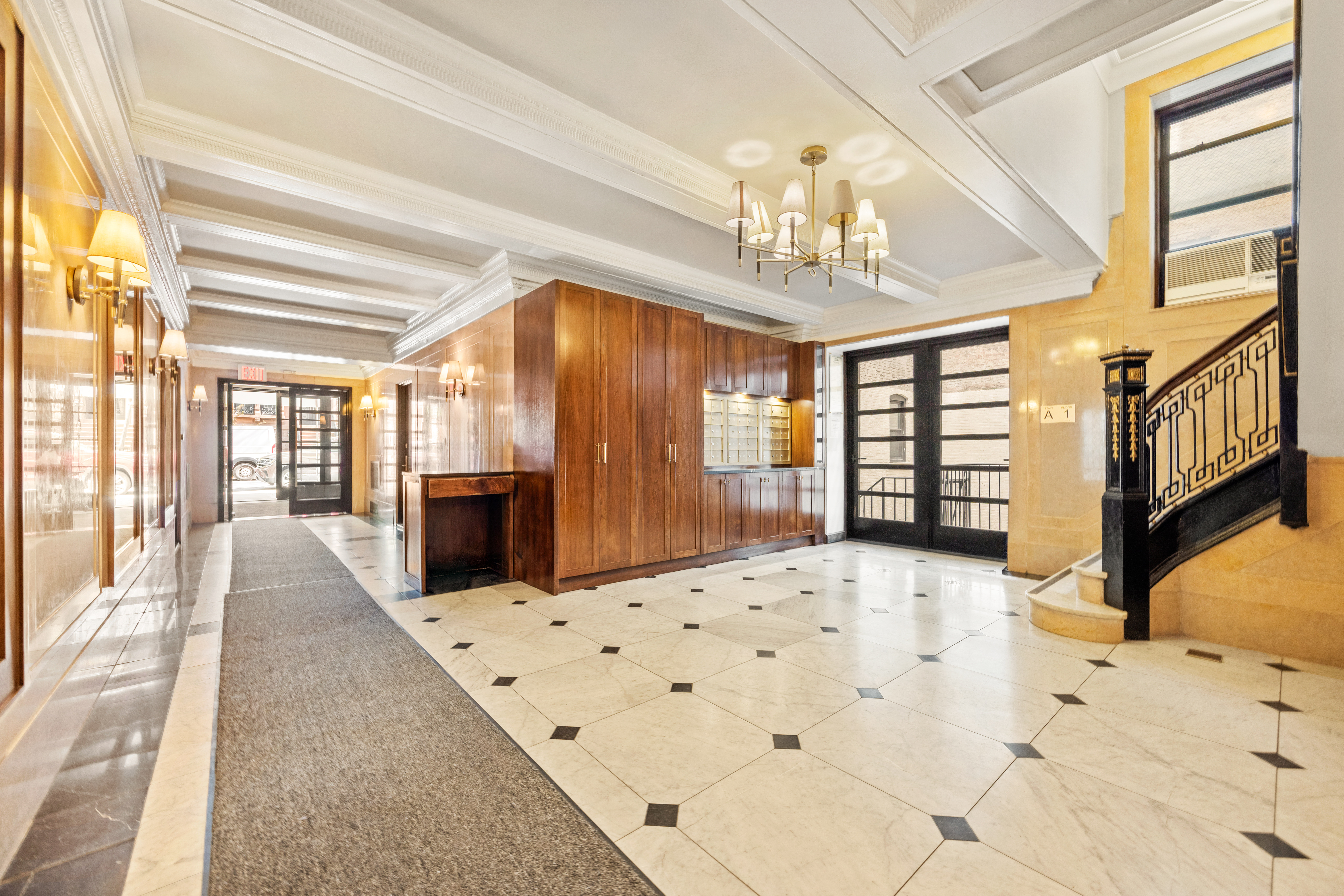 150 West 87th Street, Unit 7C Manhattan, NY 10024 - Photo 17 of 18 a large bedroom with wooden floor and chandelier