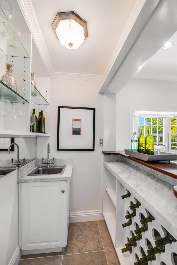 a kitchen with a sink and a stove top oven