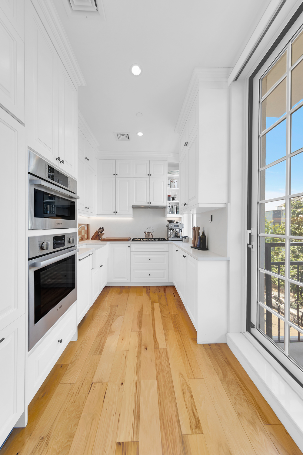 278 Nassau Avenue, Unit 4 Brooklyn, NY 11222 - Photo 6 of 17 a kitchen with granite countertop white cabinets and stainless steel appliances