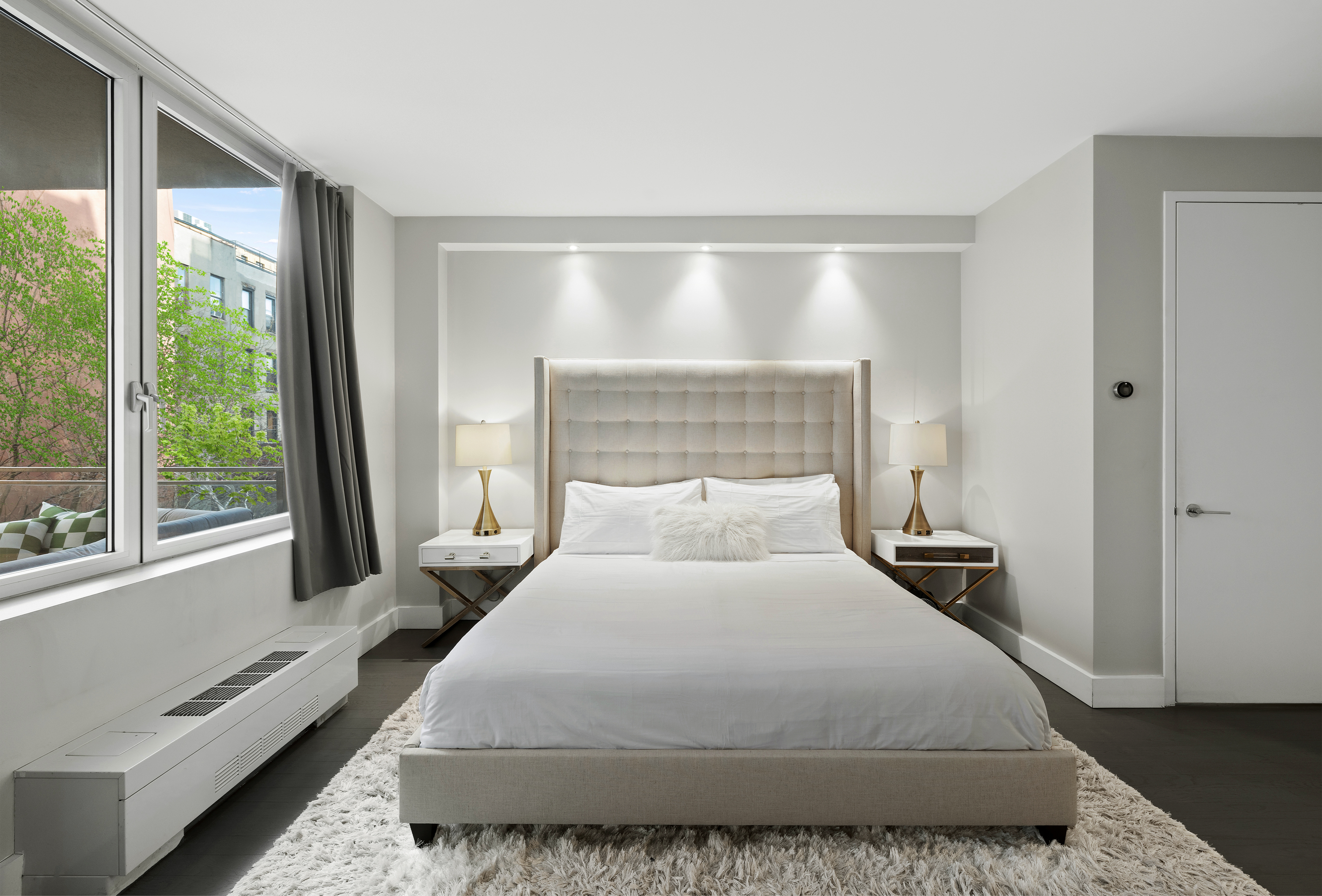 129 West 123rd Street, Unit 3 Manhattan, NY 10027 - Photo 8 of 20 a bedroom with a large bed and a large window